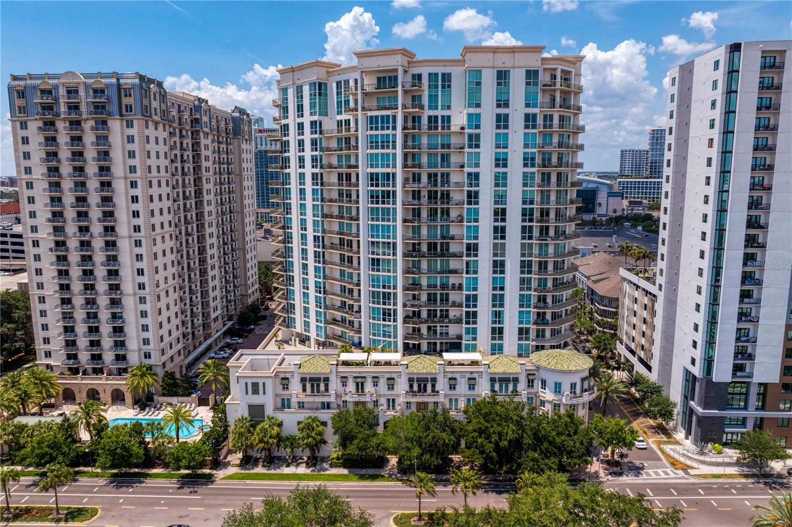If you’re searching for breathtaking views of Downtown Tampa, this Plaza residencedelivers them from every angle. Perched on Harbour Island with walkable access to thecity’s best dining, entertainment, and waterfront experiences, this three-bedroom,3.5-bath home blends luxury, convenience, and panoramic beauty. Your private elevatorlobby opens to a sophisticated, entertainment-ready layout with a bar, open livingspaces, and floor-to-ceiling glass capturing the skyline, Water Street, Sparkman Wharf,and passing ships. The wraparound balcony becomes an extension of your livingspace—perfect for morning coffee or sunset gatherings. The primary suite is a peacefulretreat with dramatic arena views, abundant natural light, and a spa-inspired ensuite.Two additional bedrooms offer privacy and flexibility. A rarity, this residence includesthree parking spaces and a dedicated storage unit add everyday ease. At The Plaza,residents enjoy white-glove services—valet, concierge, 24-hour security—andbeautifully updated amenities including an infinity pool, cabanas, fitness center, mediaroom, social lounge, business center, conference rooms, and a private guest suite. Withimmediate access to Riverwalk, Water Street, Benchmark Arena, Sparkman Wharf, theWater Taxi, and Bayshore Boulevard, this is one of Tampa’s most coveted addresses.
