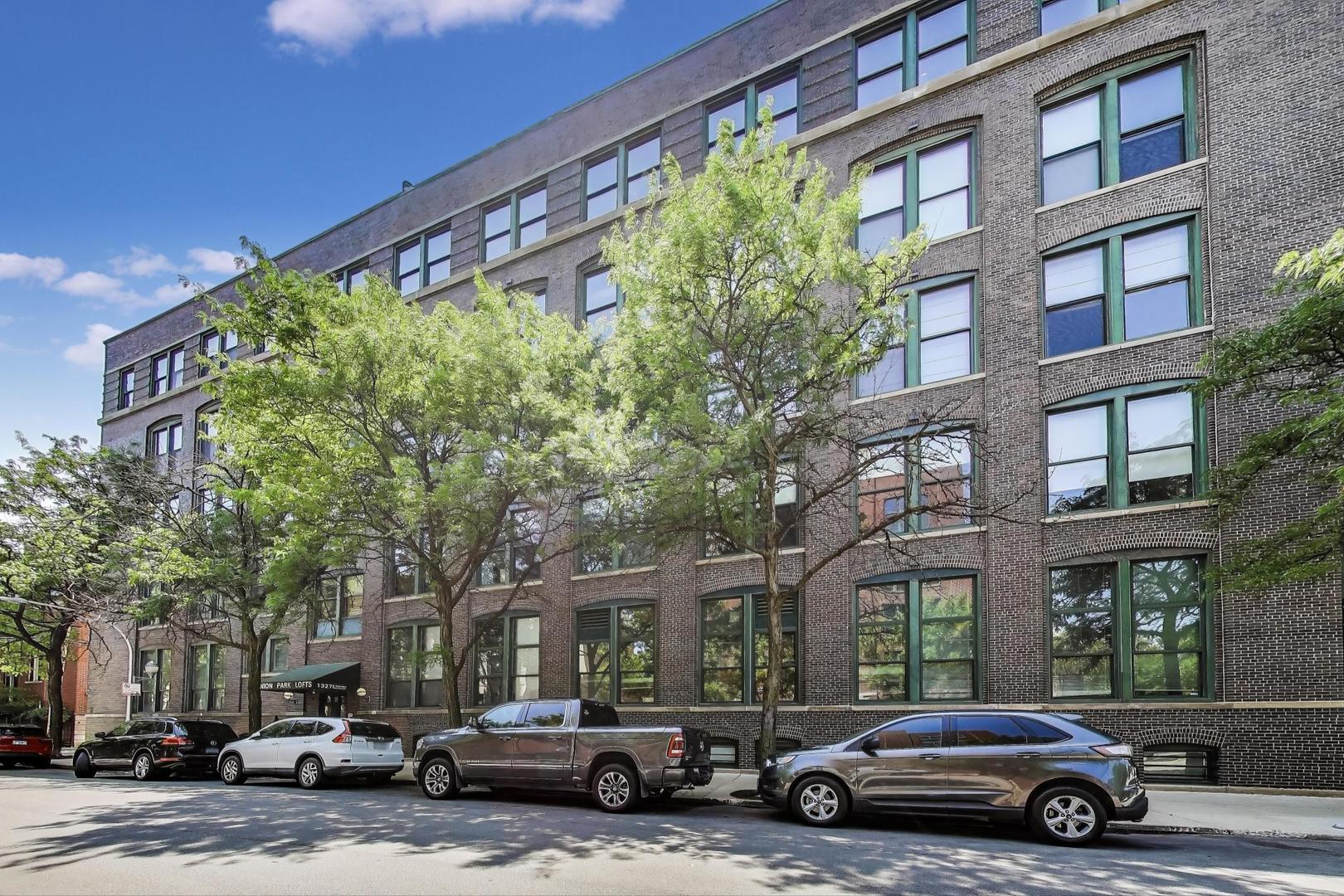 Impeccable style meets industrial, vintage chic in this stunning smart home in cool, boutique, live/work Union Park Lofts! Sensational location on a tree-lined street in the heart of the West Loop, only steps from Skinner Park and the thriving Fulton Market area. This striking space features a wide open floor plan, original oak flooring refinished in 2019, custom lighting, exposed brick and 11' concrete ceilings. Huge windows with electronic shades provide abundant natural light. Dramatic, walnut-paneled entry foyer. Expansive living areas plus adjacent second foyer area ideally suited for den or office. Large, separate dining room. Beautiful chef's kitchen completely remodeled in 2019 features custom walnut cabinetry, Quartzite counter tops and back splash, Thermador appliances including a 6-burner range, a large pantry, custom built-ins and an enormous island with breakfast bar. Striking, spa-like baths remodeled in 2022 feature Quartzite counters, custom cabinetry and mosaic tile flooring. Large, fully enclosed bedrooms feature luxurious carpeting and professionally organized closets. The enormous primary suite features a floor-to-ceiling, organized, walk-through closet with custom built-ins, a spa-like bath with double vanity remodeled in 2022, and blackout shades. Large utility room with in-unit laundry and abundant storage. Stunning, well-furnished common roof deck ideal for seasonal entertaining features breathtaking, unobstructed City views and built-in grills. Sophisticated smart home system controls lighting and access remotely. Nest thermostat. HVAC new in 2014. Hot water heater new in 2022. On-site, secured, deeded garage parking space and full-height personal storage locker included. On-site bike storage. Quick and easy access to Restaurant Row, the thriving Fulton Market District, the boutiques, restaurants and entertainment venues on Madison Street, CTA buses and Green, Brown, Orange, Pink, Purple and Blue Line trains, the interstate highway system, Whole Foods, Mariano's and Jewel. Pets welcome! Flat screen TVs and all installed works of art are excluded from the sale and do not transfer with the property.