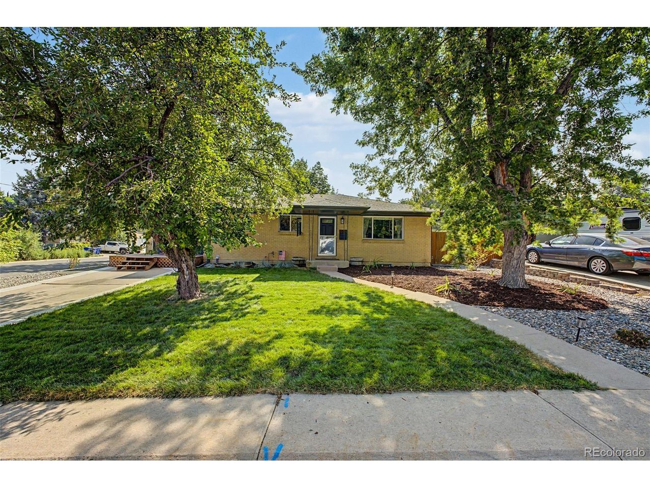 Look no further! Beautiful 4 bed, 2 bath residence in the highly sought after community of Cedar Vale in Littleton is the one for you! Nestled on a premium corner lot featuring a professionally manicured landscape w/ lush natural green grass, brick veneers, a welcoming front porch, and a detached 2 car garage. Inside you will find spacious dining & living areas w/ elegant updated flooring and custom palette throughout. The fabulous kitchen is comprised of custom wood cabinetry w/ ample counter space with tons of storage, tile backsplash, and high-end appliances for all your home cooking needs. Oversized bedrooms promise you and your loved ones a good night's sleep! Continue downstairs and into the large basement, where you will find a spacious bonus room w/ newer soft carpet, ideal for an entertainment center and/or play room. Step out back to your own private oasis including a charming designer patio with stone pavers and plenty of space for grilling, relaxing, and BBQing, this home is a true gem! Don't miss out!