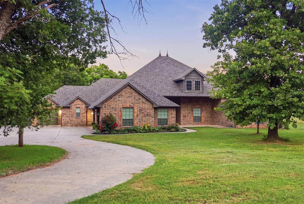 Escape to your private Oklahoma paradise on 10 incredible acres in rural Norman.Best of both worlds awaits: peaceful country living just a short drive from town. Situated on a quiet paved road and surrounded by mature hardwood trees, this stunning 3,378-square-foot home offers four bedrooms and four bathrooms with a large open floor plan that’s perfect for entertaining family and friends.Step outside onto the covered patio and take in the serene views of your beautiful stocked pond, where fishing is always an option. Whitetail deer and other wildlife regularly call these ten acres home, creating a true nature retreat right outside your door. A fenced backyard keeps pets and children safely contained, while a large insulated shop, three-car garage, and additional single-car garage provide exceptional space for vehicles, hobbies, and storage.The versatile large bonus room can easily become extra living space, a spacious bedroom, or a private office—whatever your lifestyle needs.This is more than a house—it’s the dream home you’ve been waiting for. Schedule your private showing today and experience the perfect blend of space, privacy, and comfort.