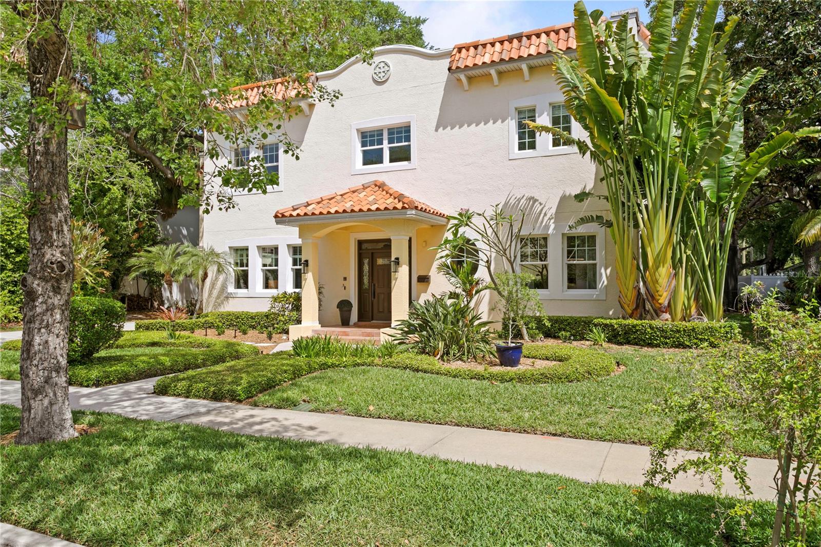 This stunning transitional Mediterranean 5-bedroom, 3.5-bath pool home is ideally located in the Palma Ceia West/Virginia Park area, one of South Tampa’s most desirable “NO FLOOD ZONE” neighborhoods, with wide, tree-lined streets and manicured lawns. Situated on a rare 100x100 lushly landscaped lot, this custom-built all-block home shows beautifully from every angle, with thoughtful design and luxury appointments in every space.Gorgeous dining room with 800+ bottle wine room, flexible office/den/library space and half bathroom with beautiful Venetian plaster finishing all flank the stunning entryway, with luxurious adornments such as hardwood flooring, 10-foot ceilings, rich crown moulding and baseboards, wood window casings, and solid core doors featured throughout the home.The newly painted true gourmet chef’s kitchen features custom cabinetry, granite countertops with center island and breakfast bar, high-end luxury stainless steel appliances, spacious closet pantry, and natural light pouring through the wall-to-wall windows. Thoughtful details like convenient refrigerated drawers, double ovens and microwave at custom height, and upgraded Wolf gas cooktop truly allow the house chef to make daily masterpieces.The formal dining room is truly a special space, with wrap-around windows and French doors with transom window that open to the lush side yard.  And just off the dining room, the wine lover will appreciate the spacious, temperature-controlled 800+ bottle wine room featuring built-in shelving and showcase spaces.The family room features a custom fireplace and French doors with transom window leading out to the incredible outdoor living space, which features a large covered entertainment area, heated saltwater pool and spa, firepit sitting area, tool/storage shed, a large side yard, tropical landscaping and splendid trees for shade.The second floor features the spacious owners retreat with ensuite bathroom, dual vanities/sinks, double walk-in closets, and private terrace, all providing tranquility and privacy from the rest of the home. Hardwood flooring in the stairwell and hallway leads to three additional bedrooms sharing a hallway bathroom with dual sinks and separate tub/shower room.  A large sun-filled laundry room with high-end LG washer and dryer and new quartz countertops, and an additional in-law suite, featuring a large separate sunlight-filled bedroom with large private terrace, flexible office/den/studio space, and full bathroom with natural light complete the upstairs space.Additional features include a newly painted interior, new fans and lighting fixtures, new stepping stone pathway from the driveway to the front door, oversized two-car garage with new high-end epoxy finish, and large front driveway providing ample parking space.  Walk to South Tampa's top schools, enjoy dog-walking along sun-dappled sidewalks, and the incredible shopping and dining options all within close proximity, including Publix, Sprouts, CVS and Michelin acclaimed restaurants.  No flood insurance is required, and no flooding has occurred in this high and dry property.Offering convenient access to the area’s best public and private schools, hospitals, premier shopping, dining, entertainment, TIA Airport, Downtown Tampa, bridges to the beaches, historic Bayshore Boulevard, and much more, this stunning home must be seen in person to appreciate all of the lovely touches and well-designed appointments.