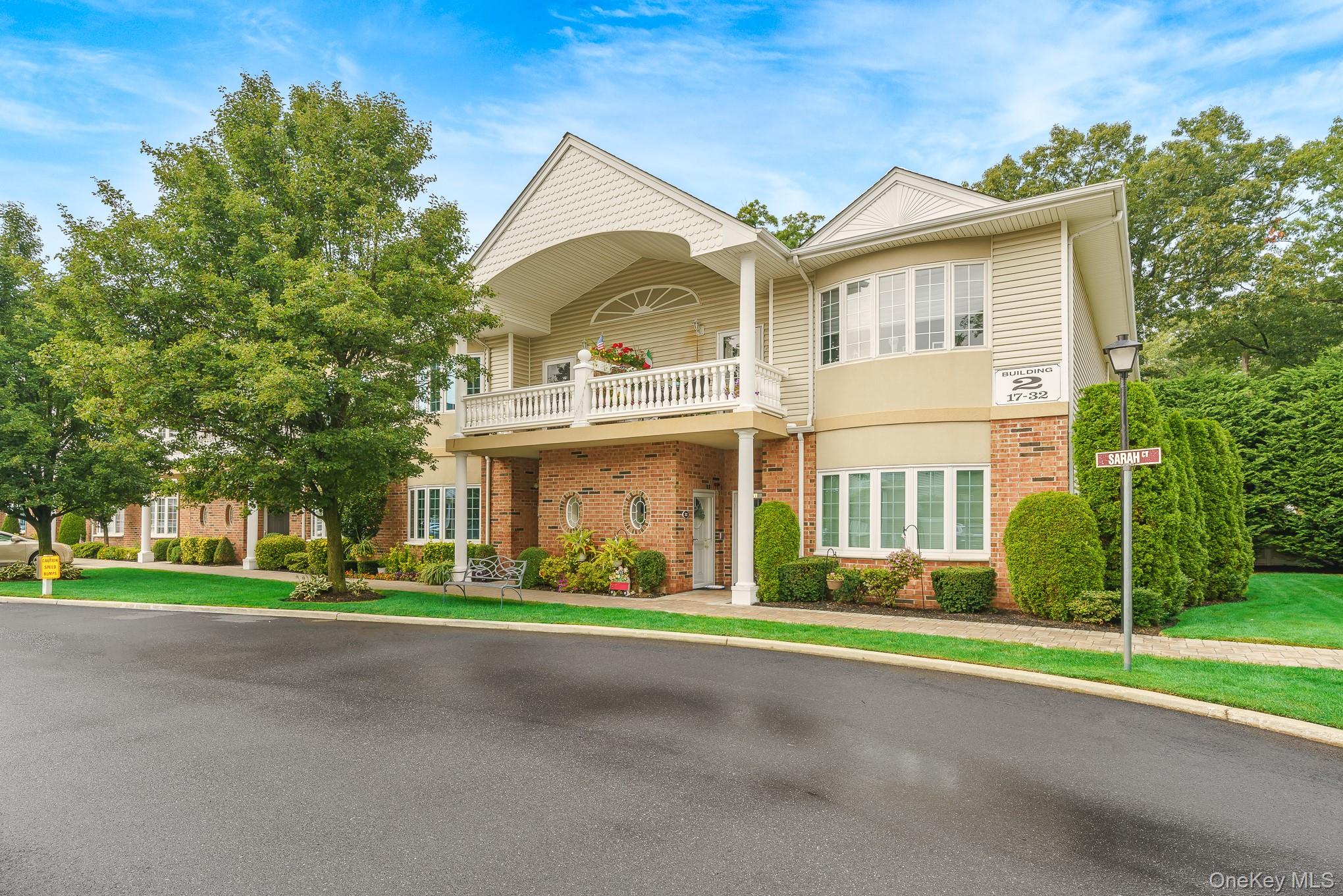 Welcome to this highly sought-second-floor unit located in the picturesque Village Estates 55+ community. Spanning the entire second floor this sun-drenched 2-bedroom, 2-bath residence showcases a spacious open-concept layout thoughtfully designed with stylish, modern finishes throughout,  including newly installed Coretec LVP wood flooring and abundant storage space. A entry foyer on first floor leads into stairs to second floor to the eat-in kitchen, featuring stainless steel appliances and cherrywood cabinets, granite countertops, Reverse Osmosis Water Filtration System, a breakfast bar, and a cozy dining area perfect for everyday living. The kitchen opens effortlessly into the expansive living and dining spaces, where oversized windows provide access to a private outdoor terrace. The generously sized primary suite offers sophisticated high hats, crown molding, a large walk-in closet (California closets), and a private ensuite bath. Second bedroom with walk-in closet, full hall bathroom, and a separate laundry room with in-unit washer and dryer complete the home. Residents enjoy access to an array of resort-style amenities, clubhouse - picnic tables and BBQ at the clubhouse, billiards/game room, beautifully landscaped courtyard. Pet-friendly and ideally located near shopping, restaurants, and public transportation, this is a rare opportunity to own a desirable second-floor unit in one of Amityville’s premier 55 and over communities. Don’t miss it!!!