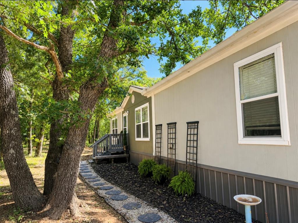 Charming Country Retreat Near Lake Thunderbird. Escape to your private oasis with this beautifully designed home nestled on 2.2 peaceful acres. This spacious 3 bed/ 2 bath features an open floor plan designed for comfort and entertaining. The large kitchen is a dream and features an oversized island, gas stove, tons of storage and counter space, wet bar, and did I mention the LG Instaview refrigerator stays! The spacious master suite is privately located on one side of the home with a huge master bath, walk in shower, jetted tub and built in vanity. On the opposite side of the house, you'll find a full size bath and two additional bedrooms, one of which is accessible to the bathroom. Walk outside and relax on your large covered patio or watch the family play in the above ground pool. Property also features a 20x30 shop with electric as well as a she-shed with power and a window unit. Home inside and out is wheelchair accessible! Cox Fiber has been brought out for internet. Property also has RV pad and power hookups. Tucked just off the beaten path this one offers the perfect balance of seclusion and accessibility. Come see why this one feels like home