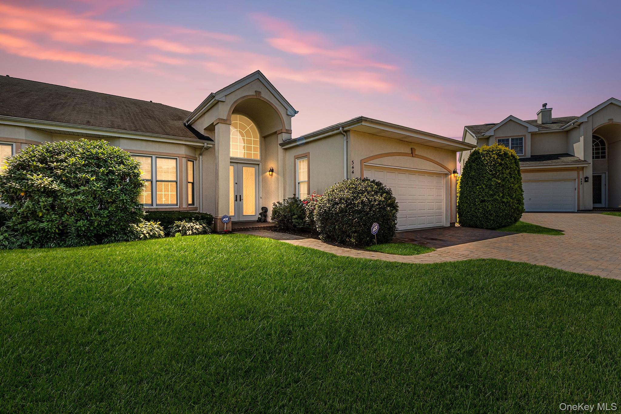 Welcome to this beautifully maintained home in a gated 55+ community offering resort-style living. Enjoy an open floor plan featuring an eat-in kitchen with a breakfast bar island, double wall oven, and plenty of space for entertaining. The living room boasts a cozy fireplace and stunning floor-to-ceiling windows that fill the space with natural light and offer tranquil views of the back patio and community pond. The spacious primary suite includes a full ensuite bath with a soaking tub, dual vanities, and a separate shower. A large full basement provides ample storage or additional living space. Community amenities include a clubhouse, golf course, pool, tennis courts, and more.