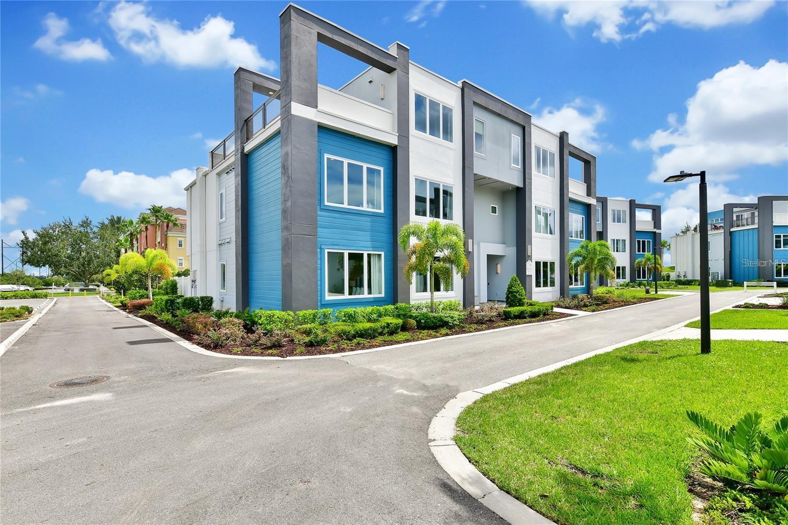 Get ready to start living the Florida lifestyle!  Have you visited Florida so much that you thought it may just be easier, and more cost effective to own a home here, well you are right indeed!  This fully furnished home is simply that; a place to call home when you visit, and then rented out while you're not here to offset the cost of ownership.  Only 5 years young, this two-story condominium is the epitome of modern luxury, with secured access from the ground level, and a convenient elevator location so that you can easily bring your luggage in and out.  Do you need extra convenience....how about being one of the closest buildings to the state of the art clubhouse, fitness and pool, only a stone's throw away from your front door!  Not only does this make it easier to maximize your time while you're here visiting, but an enticing selling feature for guests who are staying there.  Once inside, you can immediately begin to appreciate the design and updates that were thought about during design, including the extra large 36 x 16 tile flooring, timeless decor and art, as well as all of the finishes and hardware that were added.  Your primary bedroom is located on the first level, with its own large en-suite bathroom, including dual vanities with plenty of lower cabinetry, as well as a walk-in shower.  Two more bedrooms, with a full bathroom in between them (shower & bathtub) are on the first level as well, along with one more bedroom on the same floor.  Separate from the first level, and for additional privacy, your fourth bedroom is located on the second floor, with another full bathroom, in addition to a massive sized loft with a new pool table.  Do you like to be outside and enjoy the warm Florida sunshine....well check!  This home is one of very few who have an outside balcony, accessible from the loft, and is the perfect spot to host those family gatherings and host your holiday parties.  Enjoy your morning cappuccino or an evening cabernet while you gaze out onto the blue skies, and make those long last memories with the ones you spend time with.  FULLY FURNISHED WITH ALL DECOR, ARTWORK & APPLIANCES | WALK TO THE CLUBHOUSE | OUTSIDE BALCONY | TURNKEY INVESTMENT | Don't you deserve to own a little piece of the sunshine state?