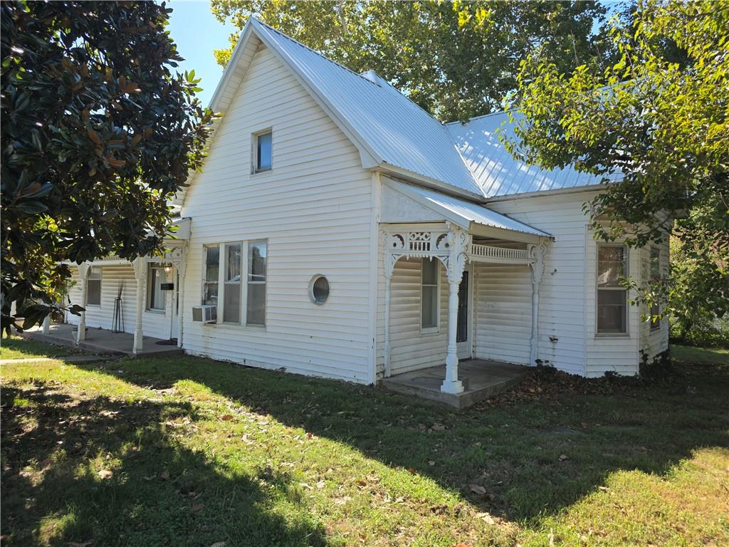 This home was once the home of WB Lewis of historic El Dorado Springs!  Restore this hidden gem to it's old glory!  The build features high ceilings throughout with wide, open spaced rooms.  There is a detached 30'x24' garage/shop on a cement floor.