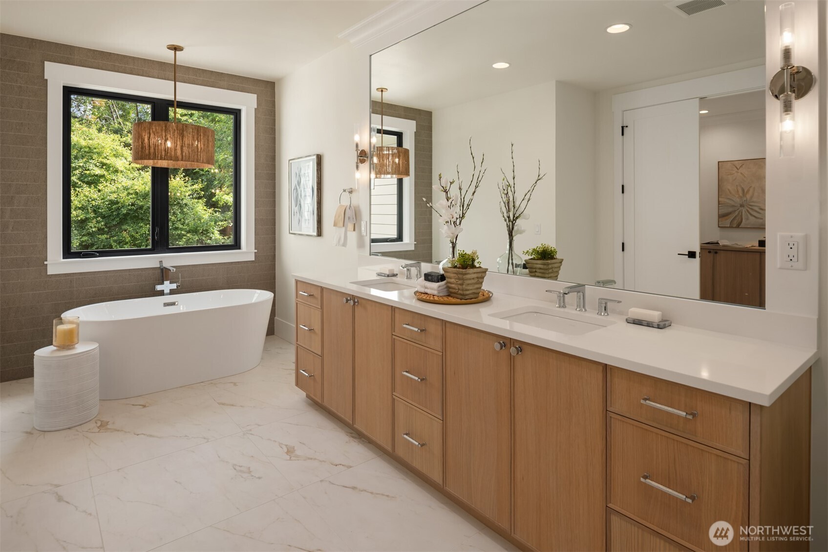 Elegant bath featuring a freestanding soaking tub.