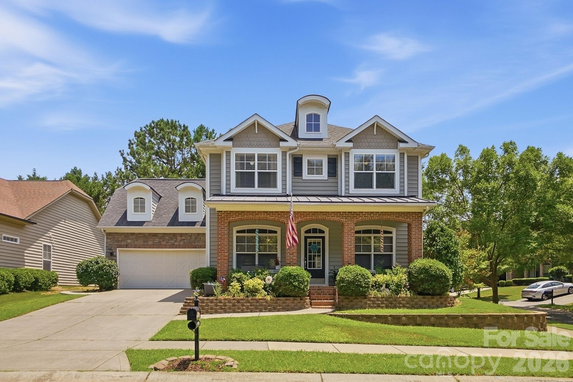 Have you been looking for a home that faces a private greenway instead of another house? How about a corner lot in the desirable Cureton community, zoned for Cuthbertson schools? This 2,659 square foot home offers 3 bedrooms, 2.5 baths, a huge bonus room, and a separate office. Mornings start on the covered front porch, looking out at green space instead of a neighbor's driveway. Inside, the kitchen opens right into the living area with dark granite counters and a gas fireplace nearby, so you are never cooking off in another room while everyone else is together. Upstairs you get three bedrooms and two full baths, plus a bonus room big enough to use however you need it, and the office downstairs finally gives you a door that closes. Out back, the extended patio and fenced yard are waiting for you. And Cureton gives you the rest: the pool, the clubhouse, the fitness center, the playground, and walking trails all through the neighborhood. Shopping, dining, and entertainment on Providence Road are just minutes away. It's all here, and it's ready for you.