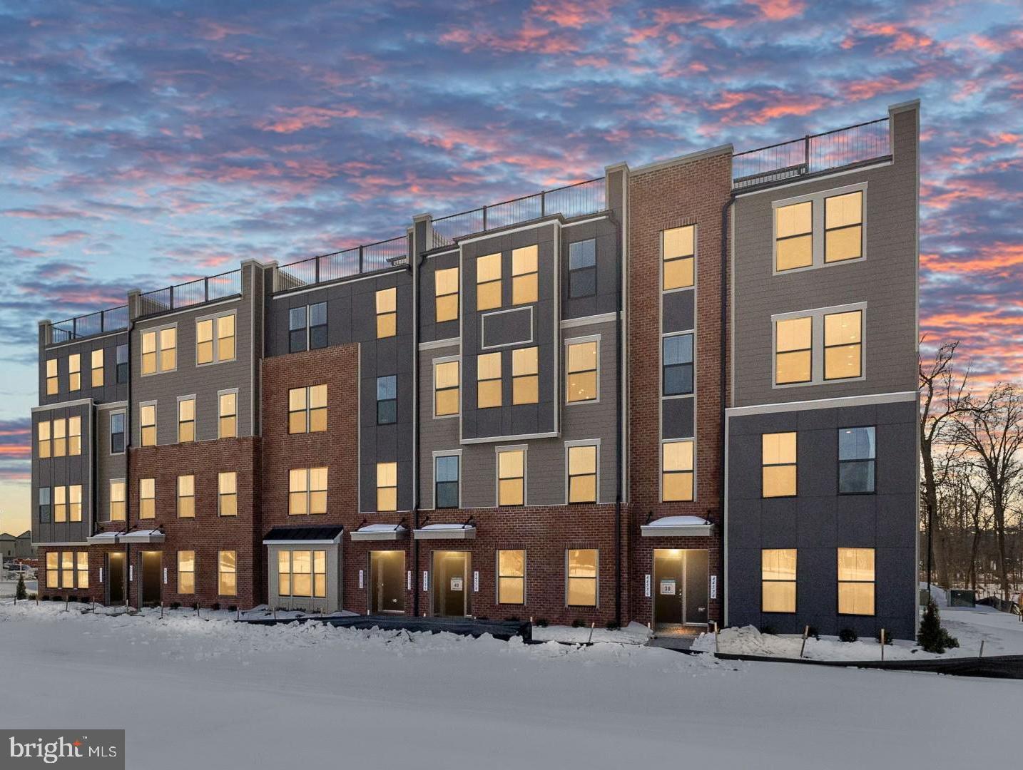 **Up to $30K IN FLEX CASH WITH USE OF APPROVED LENDER AND TITLE! Lower your price, cover your closing costs, or buy your rate down** Step inside the Clarendon, where thoughtful design and stylish finishes come together in every room. Enter through the welcoming front door or enjoy the convenience of access through the private rear garage—both leading into the main living level. At the heart of the home, the gourmet kitchen shines with designer pendant lights over the oversized 12' island. An upgraded induction cooktop and walk-in pantry complete this chef-ready space. Just beyond, the dining room flows seamlessly into a spacious great room that opens to a covered lanai, ideal for indoor-outdoor living. Upstairs, the primary suite offers a private retreat with an expansive walk-in closet and a spa-inspired bath featuring a ceramic-tiled walk-in shower with seat, frameless shower door and two shower heads. Two generously sized secondary bedrooms share a full hall bath with dual sink vanity and upgraded ceramic tile. A full-size washer and dryer are conveniently located on this level. Continue up to the impressive rooftop terrace to take in sweeping views of One Loudoun Central Park and Town Center—the perfect spot for morning coffee or evening entertaining.