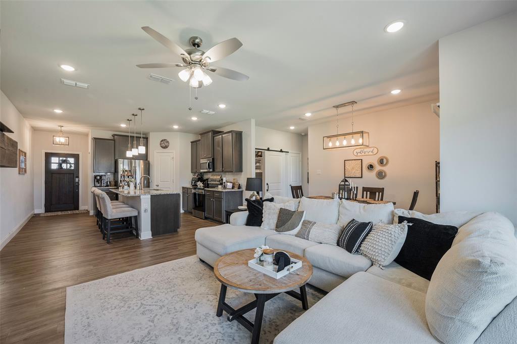 This like-new home, built in 2022, is amazingly maintained and offers a spacious, modern layout featuring 4 bedrooms, 2 baths, and a dedicated office in the highly sought-after Bailey Ranch Estates. Fresh paint enhances the bright, open-concept design, where the kitchen includes a walk-in pantry and flows effortlessly into the living area with a cozy electric fireplace. The dining area leads directly to the back porch and backyard, making it perfect for relaxing or entertaining.The primary suite provides plenty of room for your furniture and features an ensuite bathroom with dual vanities, a beautiful walk-in shower, and a large walk-in closet. Three secondary bedrooms offer flexibility for family, guests, or hobbies. Whether you work from home or enjoy streaming your favorite shows and big sports games, you’ll appreciate the high-speed fiber internet available.Bailey Ranch Estates offers wonderful community amenities, including a playground for little ones and a small dog park. If you’re looking for a neighborhood with a true family-friendly feel, this is the place to be.