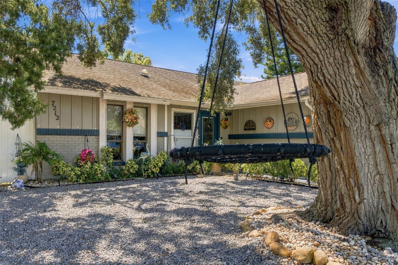 Welcome to this unique 2-bedroom, 2-bath, 2-car garage home with a heated, screen-enclosed pool and expanded living spaces offering plenty of possibilities!Designed with gatherings and flexibility in mind, this home offers additional bonus areas currently being used as sleeping spaces. The spacious rear bonus room has its own private entrance and dedicated A/C unit, making it an excellent option for guests, a home office, recreation room, or additional living space. The former dining area is also currently being utilized as additional sleeping space.Step outside to your own private Florida retreat featuring a heated, screen-enclosed pool you can enjoy throughout the year. The privacy-fenced backyard provides plenty of space for entertaining, relaxing, pets, or simply enjoying the Florida sunshine.Inside, you'll find a large kitchen with abundant cabinetry and storage, a separate laundry room, and plenty of space for family and guests. The primary suite has been updated with a custom walk-in soaking tub, offering a relaxing place to unwind at the end of the day.Additional highlights include a maintenance-friendly front yard, 2-car garage, flexible bonus spaces, private rear entrance, and year-round pool enjoyment.With its versatile layout, this property may also appeal to buyers exploring vacation-rental or Airbnb potential, subject to applicable local regulations and restrictions. Conveniently located near Florida attractions and beaches and approximately 35 minutes from Tampa, you'll have easy access to dining, entertainment, events, shopping, and everything the Tampa Bay area has to offer it's residents.If you're looking for more than an ordinary 2-bedroom home, this one deserves a closer look. The flexible living spaces, heated pool, privacy, and Florida location create possibilities you won't find in every home.
