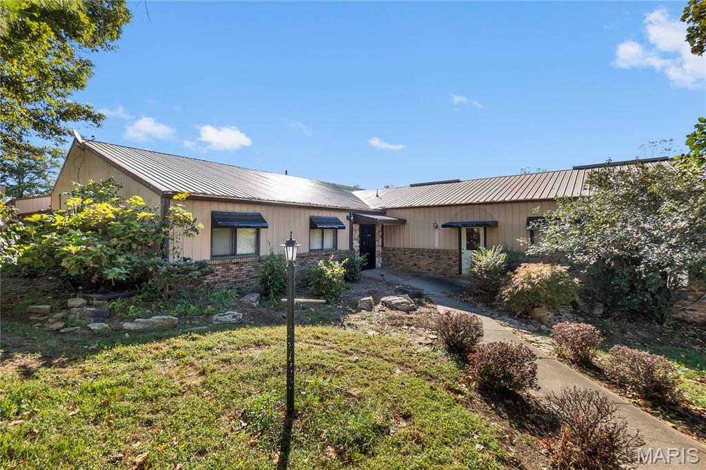 This one checks a lot of boxes for a business owner or investor looking for space, flexibility, and visibility. Sitting on 5.16+/-; acres just outside Perryville city limits, this property opens the door to even more possibilities with fewer restrictions and room to grow. The main business center features 8 offices, a reception area, spacious conference room, 2 vaults, kitchen, storage rooms, half bathrooms, product showcase space, and a 48x52 attached garage. The garage includes a half bath, electric, furnace, and overhead doors. You’ll also find an additional 88x24 outbuilding with gravel floors, electric, 2 enclosed bays, and 1 open lean-to area. Multiple entrances, two parking areas, and excellent access make this setup ideal for a variety of business operations.An added bonus? Solar panels are already in place, helping reduce utility costs and lower your business overhead even more.Located just minutes from Perryville and less than a mile from Highway 61, you can easily reach Fruitland, Jackson, and Cape Girardeau while still enjoying the advantages of being outside city limits. PCR 500 is newly paved, making access smooth and convenient.