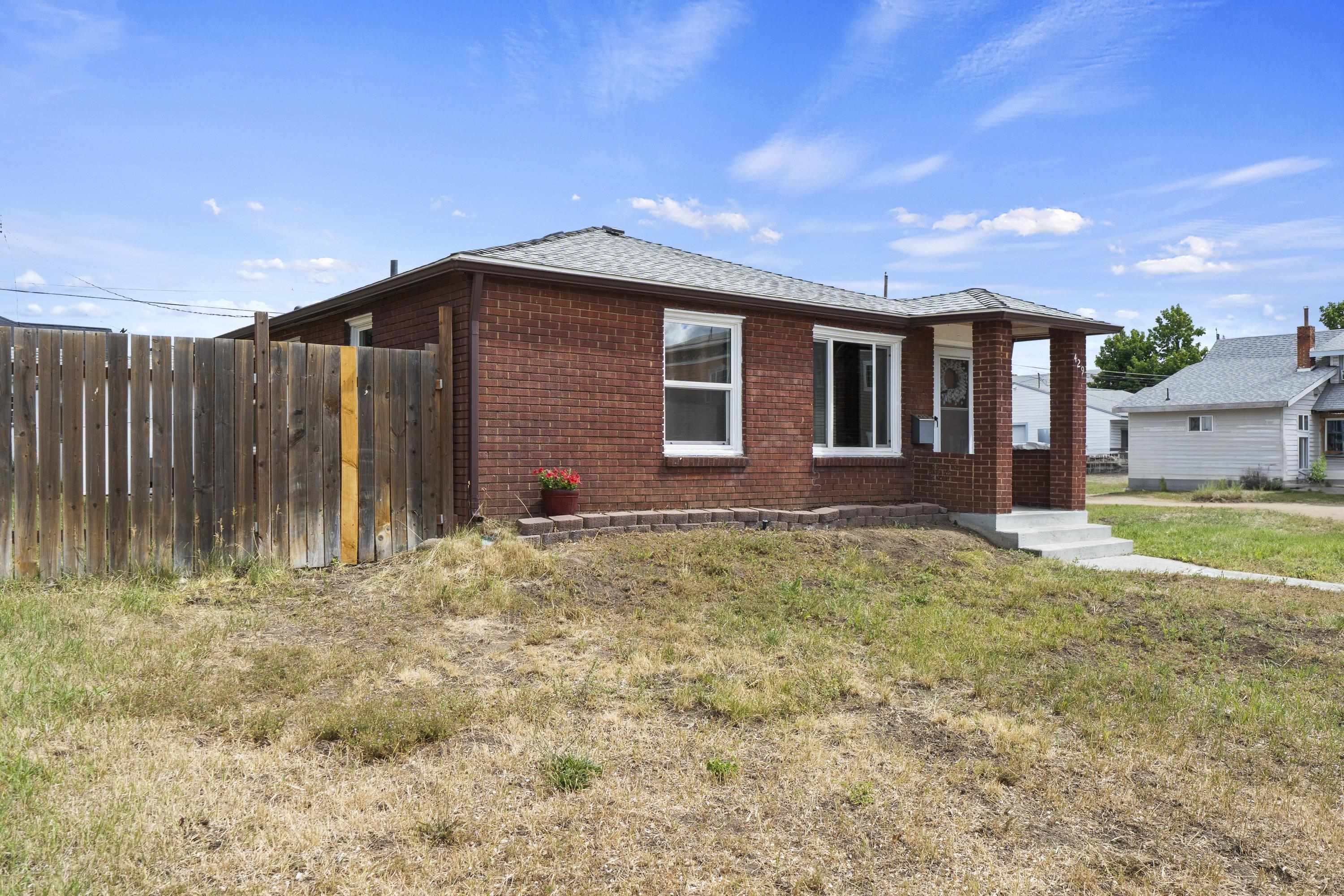 Charming One-Level Brick Home on a Corner Lot! Don’t miss this well-maintained 2-bedroom, 1 bathroom home located just minutes from downtown Spokane! Situated on a desirable corner lot, this clinker brick beauty offers 957 sq. ft. of easy living—all on one level. Featuring vinyl windows, gas forced air heat, and central A/C, comfort and efficiency go hand in hand. Enjoy the fully fenced backyard, complete with a sprinkler system—perfect for outdoor relaxing or pets. You’ll love being just blocks from Lidgerwood Park and close to shopping, restaurants, and all the amenities you need. With low-maintenance exterior and unbeatable location, this home is ideal for first-time buyers, down sizers, or investors. A fantastic opportunity in a prime location—come see it today