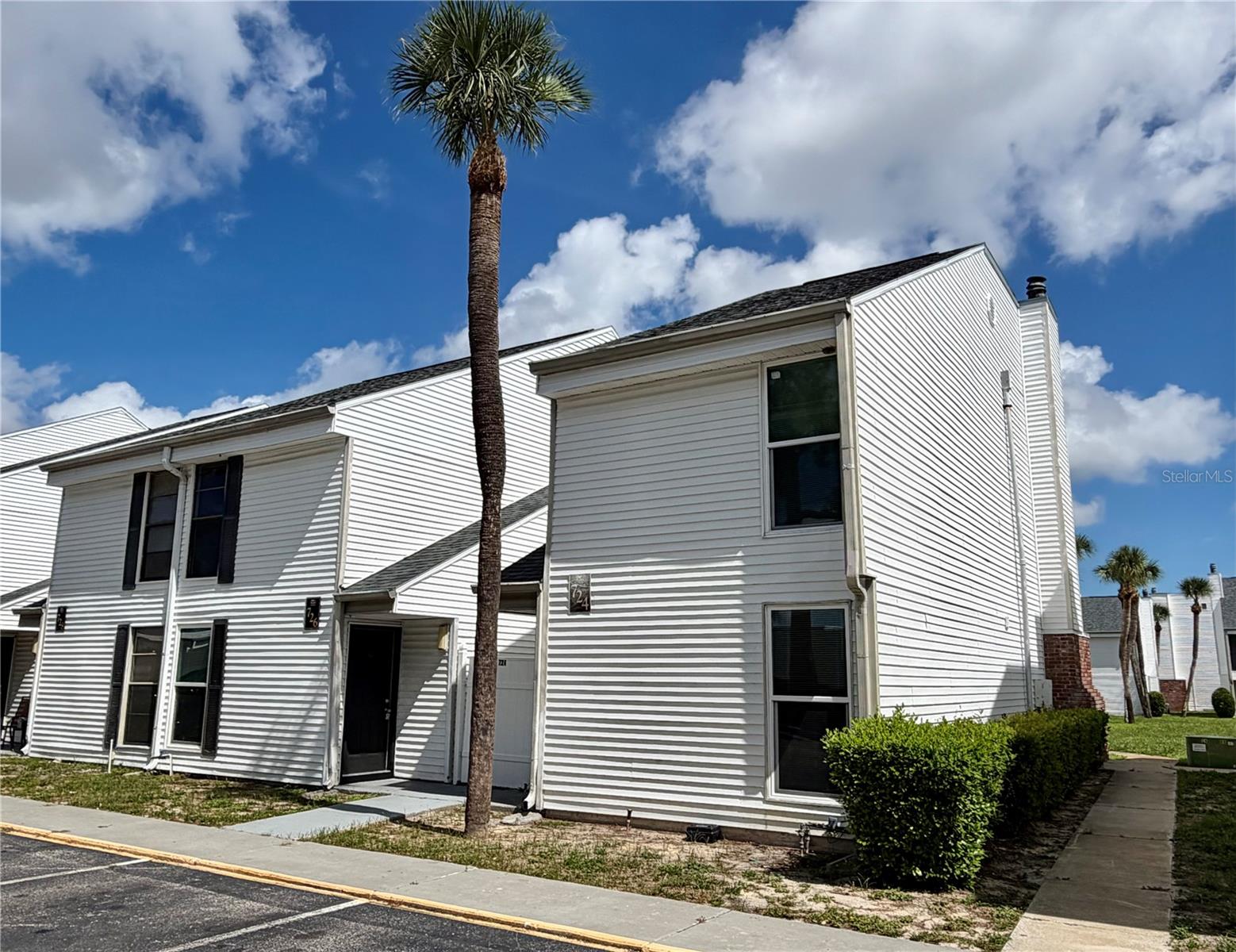 Welcome home to this bright, modern townhome-style condo in the Palms of Tarpon Springs community. Perfectly laid out across two levels, this 3-bedroom, 2.5-bath home offers the ideal balance of space, comfort, and coastal living. The ground floor features a cozy wood-burning fireplace, living room, family room, and dining room. Step through the back sliding glass doors to find your private, paved patio—an ideal setup for outdoor lounging and soaking up the sun. Upstairs, three spacious bedrooms and two full bathrooms provide ultimate privacy and comfort in just over 1,404 sq ft. The building's roof was redone in 2025. The HVAC & impact windows were installed in 2023. Residents enjoy access to a community pool and a prime location just minutes from Downtown Tarpon Springs, the Historic Tarpon Springs Sponge Docks, local dining, boutique shopping, and quick access to US-19 for effortless commuting across the Bay Area. One or more images may have been virtually staged.
