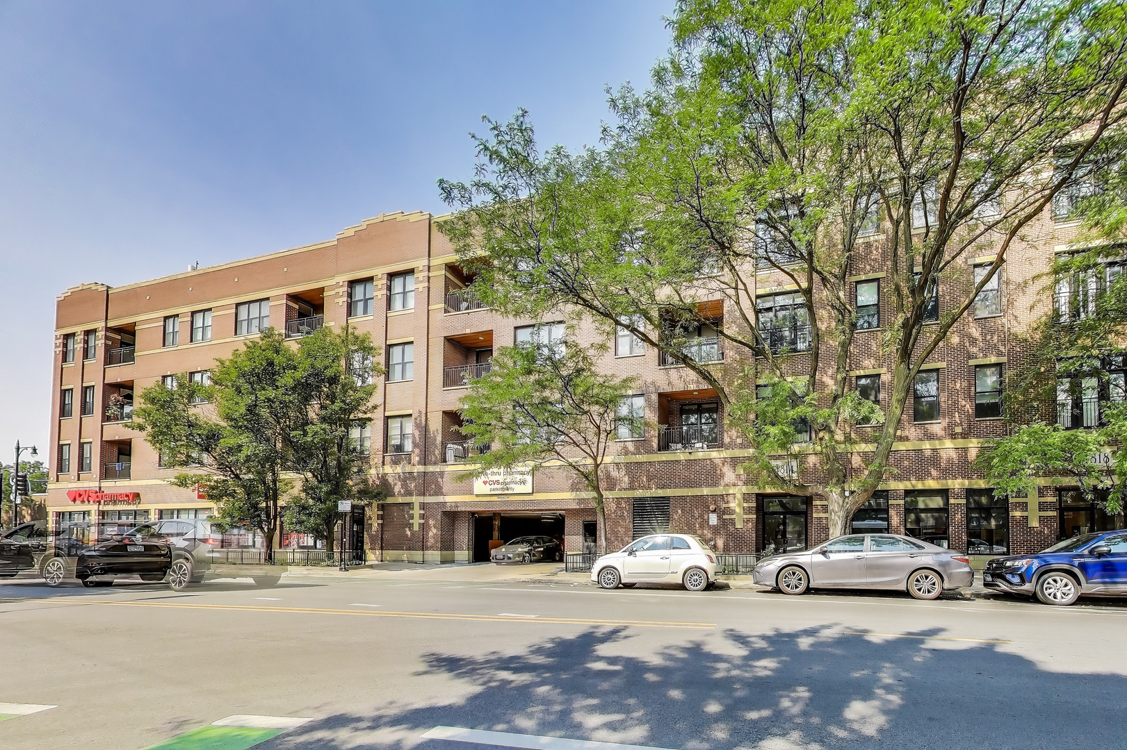 Bright and Stylish Top-Floor Condo in Prime Ravenswood Location!  This sun-drenched 3-bedroom, 2-bath condo sits on the top floor of a rarely available elevator building in the heart of Ravenswood. Tucked away in a quiet corner unit overlooking a peaceful, tree-lined street, this home offers a desirable split floor plan that provides maximum privacy and comfort.  Beautiful hardwood floors flow throughout the main living areas, while the bedrooms feature newly installed luxury vinyl flooring, replacing the former carpeting. The updated kitchen boasts freshly painted cabinetry, natural stone countertops, a new ceramic tile backsplash, and sleek hardware-centered around a spacious 4-seater island that blends function and style. The open-concept layout is perfect for easy entertaining.  The generously sized primary suite includes a custom-organized walk-in closet, an additional closet, and a full ensuite bath with dual vanities and a tub/shower combo. The second and third bedrooms are thoughtfully separated down the hall, ideal for guests, a home office, or both. A second bathroom off the hallway gives privacy to guests during their stay. Modern touches like updated light fixtures and window treatments elevate the look and feel of this home.  Garage parking is included, and commuting is simple with the Damen Brown Line just a block away and Ravenswood Metra Station only three blocks from your door! Enjoy being two blocks from scenic Winnemac Park, with its Prairie Trail, baseball fields, and playground.  Step outside and explore neighborhood favorites like Groundswell Coffee, Sweet Moon, Bryn Mawr Breakfast Club, and the popular Del Sur Bakery & Cafe. Plus, you're only minutes from all that Lincoln Square has to offer! This is city living at its best-with nature, convenience, and charm all at your doorstep!