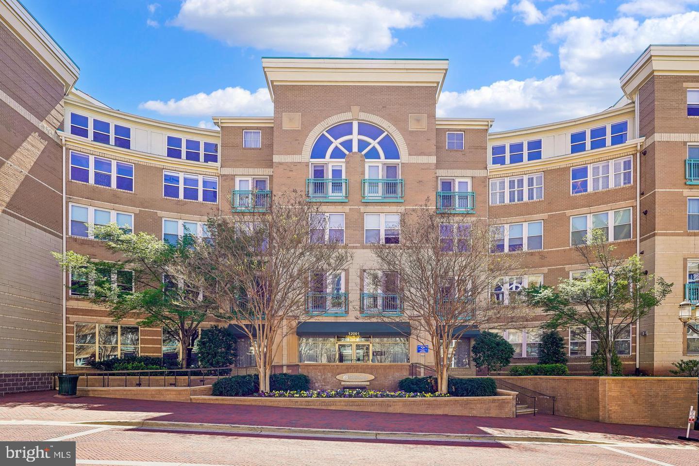 Enjoy comfortable and convenient living in this beautiful first-floor corner condo featuring a charming Juliet balcony and abundant natural light. Located in a sought-after luxury community, this home offers access to exceptional amenities, including a swimming pool, fitness center, clubhouse, business/computer center, and game room.Additional highlights include two garage parking spaces conveniently located near the elevator and a large private storage unit. Combining comfort, convenience, and resort-style amenities, this home is an outstanding opportunity in a prime Reston location.Seller prefers Elite title company for closing.
