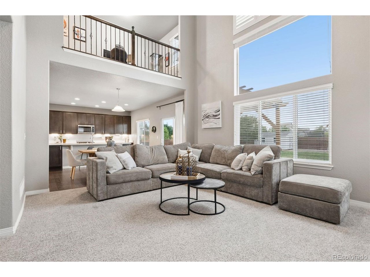 Welcome to this stunning 2-story home in the highly desirable Carriage Hills neighborhood! Situated on a spacious .24-acre corner lot, this unique home offers 3 bedrooms, 2.5 bathrooms, and a truly phenomenal layout designed for both everyday living and effortless entertaining.Upon entering, a formal dining room serves as the focal point of the home - a flexible space that can easily convert into a family room, home office, or whatever suits your lifestyle. Continue into the open floor plan, where the kitchen flows seamlessly into a daily eat-in space and a living room with soaring ceilings. Hardwood floors run throughout the main level, complementing the kitchen's timeless dark cabinetry, stainless steel hardware and appliances, quartz countertops, and a large center island. The spacious living room is filled with natural light from ample windows and features a cozy gas fireplace.The upper level is home to a suite-like primary bedroom featuring high vaulted ceilings, floor-to-ceiling windows, and a two-way gas fireplace that shines through to the spa-like 5-piece bath. A generous walk-in closet with custom shelving completes the primary suite. This level also offers a versatile loft space - perfect for a home office or separate TV/media room - along with two additional bedrooms, a full bathroom, and a convenient laundry room.The unfinished basement offers a blank canvas for future expansion - whether that's a home gym, additional living space, or storage.Outside, this corner-lot property backs to extra neighborhood parking and an alleyway for added convenience. An oversized two-car garage provides ample space for vehicles, storage, or a workshop. Enjoy an extended patio and pergola, ideal for outdoor entertaining, alongside an expansive grassy yard, garden beds, and a storage shed.Perfectly positioned with close proximity to highways, shopping, and restaurants, this home offers the ideal balance of comfort and convenience.schedule your showing today!