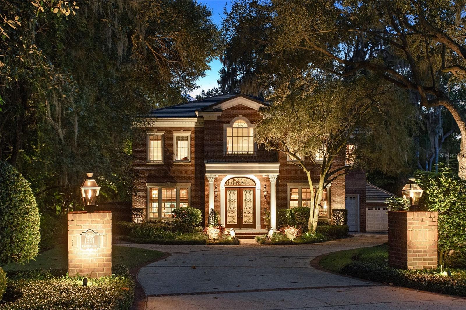 Welcome to 1391 Richmond Road, a true work of art and a surreal living experience now on the market. The most discerning buyer will fall in love with the optimal location, an unusually private lot right in the heart of Winter Park, a short stroll to Park Avenue along the stunning shores of Lake Virginia. This handcrafted Georgian style home, designed to emulate New York City townhouse living was masterfully crafted on a magical lot abundant with pristine natural vegetation. Enjoy the Florida lifestyle with frontage on Howell Creek…kayak or paddleboard amongst incredible wildlife to the Winter Park Chain of Lakes. As you arrive, you are greeted by an enticing mix of traditional and old Florida plantings, highlighted by Bevolo exterior lighting and gas lanterns leading the way to your custom mahogany/iron work front entry door. The grand foyer with soaring ceilings, stunning black and white marble flooring, and grand staircase which was built in place, with hand molded railing providing a welcoming signature. Flanked by separate formal living and dining areas on either side, the formal dining room features custom hand painted Gracie brand wallpaper and leads to the butler’s pantry with wine refrigerator. The gourmet kitchen boasts Busby cabinetry, new six burner Decor gas range, new Bosch dishwasher, Subzero refrigerator, large island with prep sink, built-in oven, and naturally lit breakfast area overlooking the backyard oasis. The kitchen opens to the spacious family room with extensive venetian painted millwork, gas/wood burning fireplace with custom Italian made marble surround, 11’4” ceilings, and French doors leading to the terrace and backyard retreat. The formal living room complete with venetian plaster, gas fireplace with custom marble is connected to the family room with a stunning barreled ceiling hallway conveniently located to a chic powder bath. The main floor also includes a full pool bath with access to one of the two garages with air conditioned work room, and a 2nd back staircase. The upstairs primary suite is a sanctuary, graced with an antiqued mirror entry, gas fireplace, double French doors leading to the serene balcony overlooking the statement backyard, and two custom closets with vast cabinetry and lighting. The spa-like bath features Walker Zanger flooring, generous walk-in shower, soaking tub and dual vanities with make-up area. Two additional ensuite bedrooms are also upstairs along with an office/flex room, full bath and laundry room. The second detached garage features a bonus room/convenient home gym. No expense was spared when building which displays antique and unique lighting fixtures, custom millwork, surround sound, central vacuum, reverse osmosis water filtration, and extensive storage throughout. Notable window treatments from the finest textile manufacturers worldwide (Clarence House, Elitis, Nancy Corzine, Carragio), wallcoverings (Fornasetti, Gracie, Schalamandre), lighting (Aerin, Niermann Weeks). This bespoke home is an entertainer’s dream with multiple outdoor areas to relax amongst the secret garden of terraced landscaping and four thoughtfully placed fountains. Celebrate nature’s wildlife which range from owls, great white egrets, blue herons, hawks, bunnies, and otters in your private sanctuary minutes to Winter Park’s premier dining, upscale shopping, Mead Botanical Garden, and the highly coveted Audubon K-8, and Winter Park High!
