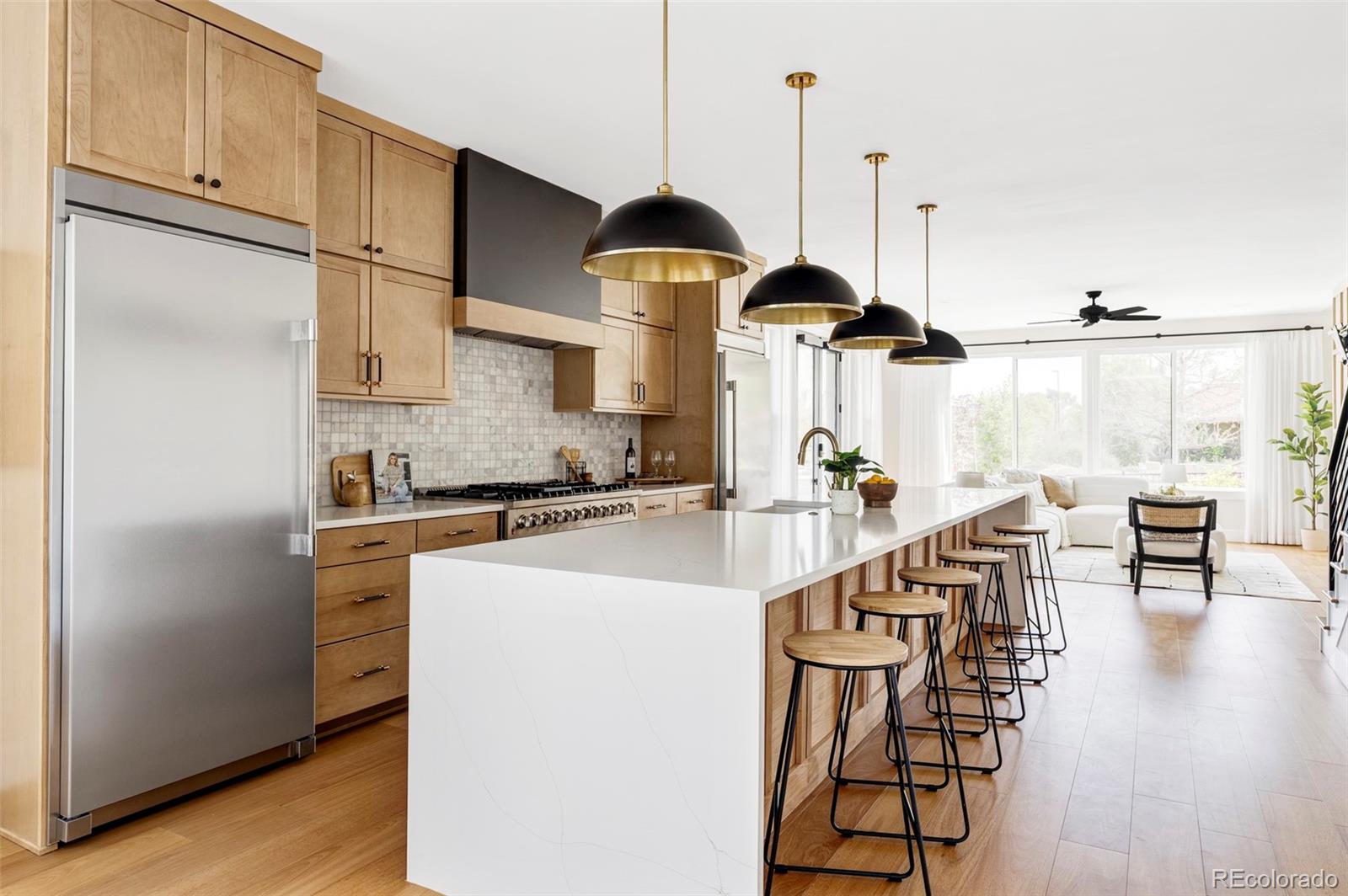 Beautiful custom-built home on Sloan's Lake with unimpeded views of the lake! This recently built home is sure to impress, with every square foot creatively used. Enjoy the open floor plan with Brazilian Oak floors throughout. The main floor is centered around a chef’s kitchen, anchored by an oversized island, quartz countertops, 48" dual fuel range, and matching built-in refrigerator & freezer. The focus of the living room is 180 degree views of the lake through the wall of windows, and the 42" gas fireplace with a custom trim surround. The mudroom provides ample storage for coats, shoes etc. Upstairs, the primary suite boasts a private walk-out balcony with views of Sloan’s Lake and the mountains, and a beautiful 5-piece bathroom with a walk-in shower, soaker tub, and high-end limestone tile! The 3rd floor has a large bonus room, wet bar, bedroom (would make a fantastic office), full bathroom, and a roof top deck with incredible lake views! This home has 2 furnaces and 2 central A/C units, as well as a whole home water filter! The detached 2 car garage has plenty of room for all of your Colorado toys! Don’t miss the opportunity to live in a high-end home with unbeatable views of the lake! Schedule your showing today.