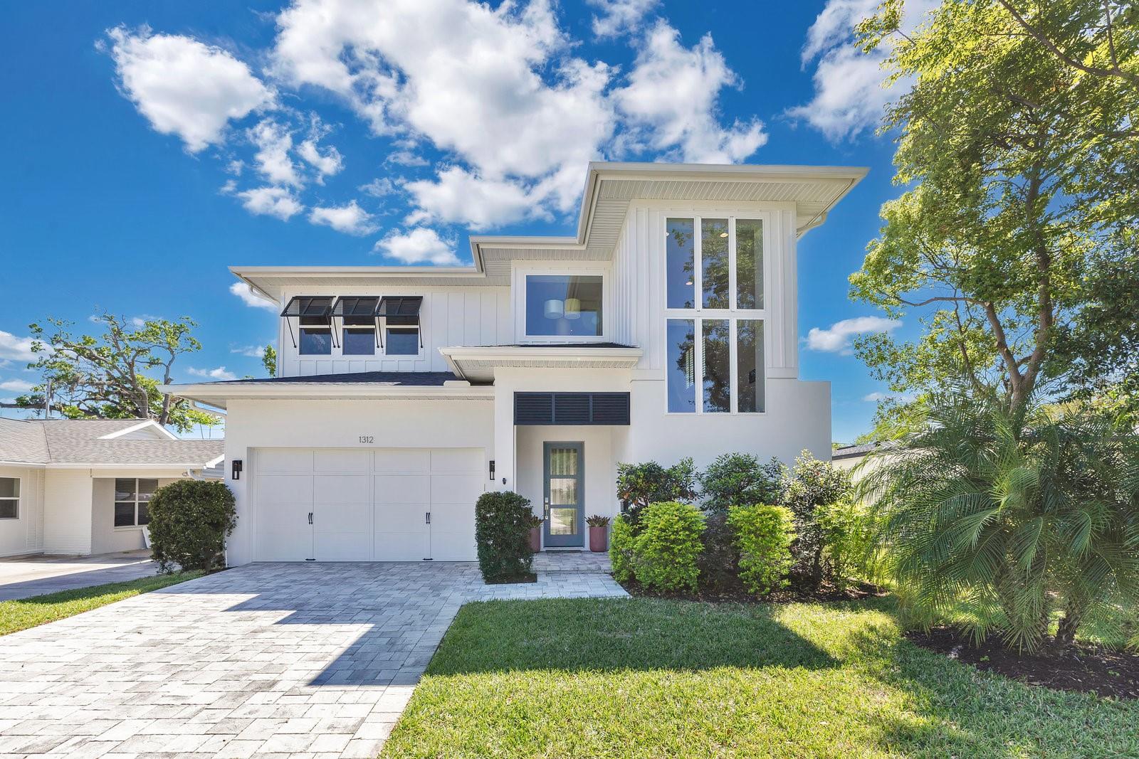 Under contract-accepting backup offers. Major price improvement on this exceptional College Park home! Welcome to 1312 Vassar St.—a custom-built pool home completed in 2021, offering 3,250 SF of luxurious living w/ 4 beds, 3.5 baths & a bonus area. This residence seamlessly blends transitional style w/ thoughtful design. Upon entering the semi-private foyer, you’re greeted by wide-plank engineered wood flooring, high ceilings & large-format windows that fill the space with natural light. To the right is the spacious formal dining room; to the left, access leads to an oversized 2-car garage equipped w/ a LiftMaster opener featuring MyQ Smart-enabled technology for remote access and enhanced security, and a well-appointed laundry room offering ample cabinetry and countertops to streamline daily routines. The rear of the home opens to a chef’s kitchen seamlessly integrated with the family room. The kitchen boasts custom cabinetry, quartz countertops, and stainless steel appliances, including a gas range, counter-depth French door refrigerator, wall oven with microwave combo, and a spacious walk-in pantry. An impressively large island with seating for four or more includes a wine/beverage fridge, dishwasher, and a large undermount sink. The family room features new custom millwork and a built-in accent wall with a sleek linear electric fireplace. Large sliding glass doors lead to the covered lanai, creating a harmonious indoor-outdoor experience. Completing the downstairs space is the primary suite, offering a serene retreat with intricate millwork and ceiling details. The en-suite bathroom features a generous vanity with double sinks, a standalone soaking tub, a walk-in shower with glass enclosure, and dual customized walk-in closets. Private doors from the primary suite provide direct access to the outdoor space. Ascending the staircase, a charming window seat offers a cozy nook. The upper level presents a smart floor plan: two bedrooms connected by a Jack-and-Jill bath and a third bedroom with an en-suite bath. A bonus room provides flexible space for a playroom, media center, or home office. The outdoor area has been transformed into a private oasis, including a covered lanai featuring a new outdoor kitchen with a natural gas grill, refrigerator, sink, storage, granite countertops, and weather-rated cabinetry. A mounted TV completes this perfect setting for outdoor entertaining. The saltwater pool is complemented by a natural gas heater and robotic cleaner, ensuring year-round enjoyment. Extensive landscaping, including privacy-enhancing bamboo, adds to the serene ambiance. The home is equipped with two HVAC systems and energy-efficient features such as a tankless gas water heater, MI Windows with low-E double-pane glass, and R-38 insulation. Ideally situated on one of College Park’s charming streets, this home offers proximity to parks, restaurants, shopping, well-rated schools, and is conveniently located between The Packing District and Edgewater Drive. The Packing District offers a variety of dining, shopping, and entertainment options, including the Orlando Tennis Centre, a state-of-the-art facility catering to tennis and pickleball enthusiasts. On the other side, the vibrant Edgewater Drive corridor boasts an array of shops, restaurants, parks, and community events, enhancing the neighborhood’s appeal. Albert Park, a notable green space, is just a short stroll away. Experience the best of urban living with a small-town feel in this exceptional College Park residence.