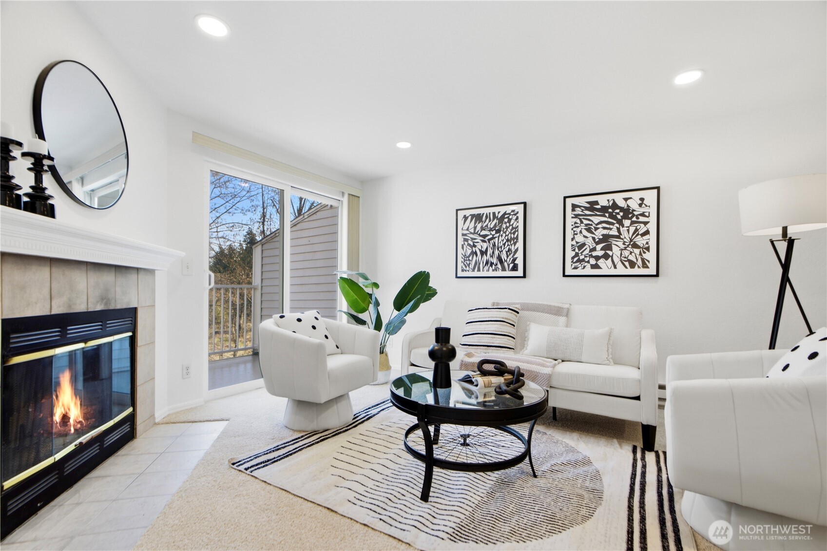 Modern top-floor condo located in Bellevue’s highly desirable Spring District neighborhood. This beautifully maintained 2 bedroom, 1.75 bathroom home offers 859 square feet of comfortable living space and backs to a peaceful greenbelt and creek, providing exceptional privacy and tranquil territorial views from the private balcony. The open-concept layout features a bright living and dining area with cozy fireplace, open kitchen with bar seating, and an in-unit laundry room with full-size washer and dryer. Two assigned parking spaces are included, one covered carport and one open space.    Recent updates include fresh interior paint, new carpet, new doors, new dishwasher, new refrigerator, new water heater, and updated lighting, making this home move-in ready. Located just minutes from Downtown Bellevue and Bellevue Square, this home sits steps from the Meta Bellevue campus, Whole Foods, restaurants, shopping, and the new Spring District light rail station, offering easy access to Microsoft, Redmond, Seattle, and major employers across the Eastside. Convenient access to I-405, SR-520, I-90, and the Bellevue Transit Center.    HOA dues include water, sewer, and garbage, plus access to the community pool and sport court. Located within the award-winning Bellevue School District. With no rental cap, this is an excellent opportunity for homeowners and investors alike.