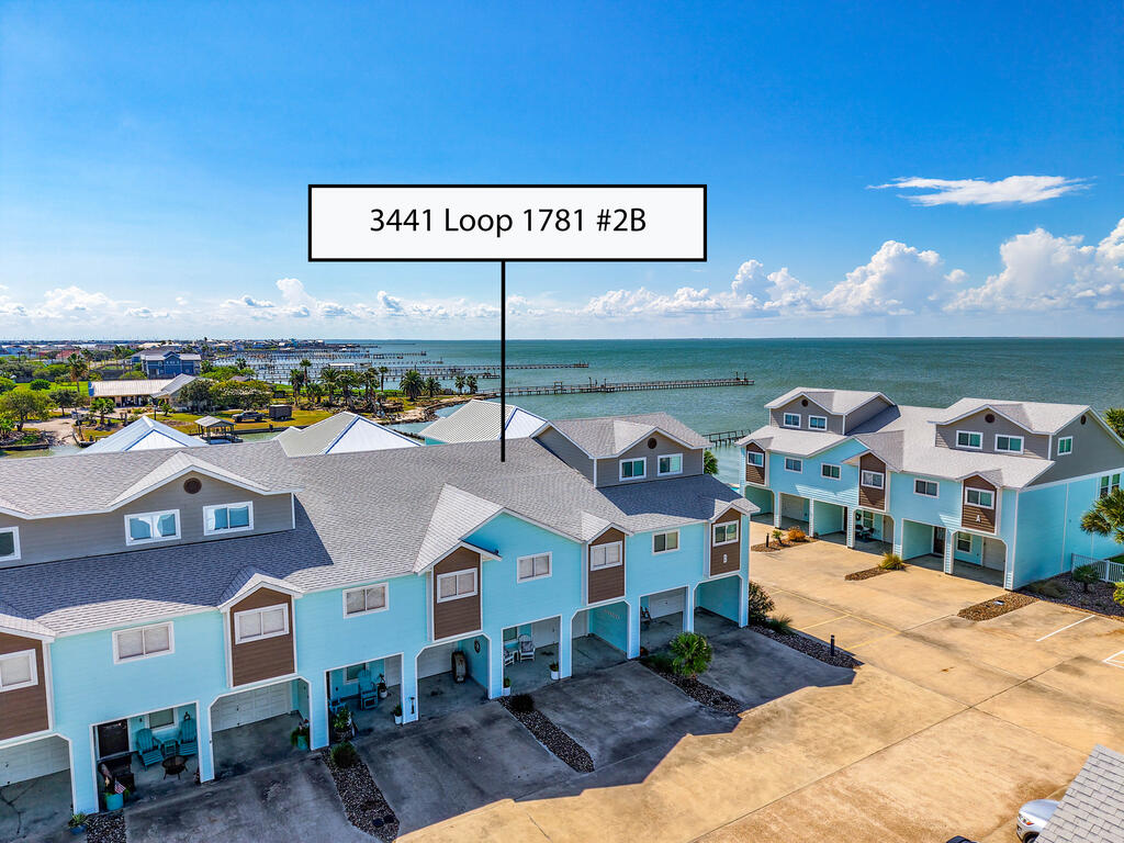 Enjoy coastal living with the convenience of low-maintenance ownership at Gables of Copano Vista, a gated waterfront community along the shores of Copano Bay. This fully furnished 3-bedroom, 3-bath condo offers a spacious two-story layout with a private first-floor bedroom and full bath, laundry area, and an oversized extra-deep garage with plenty of room for your vehicle and all your coastal gear. The seller is also offering the Jeep currently in the garage for sale, making it easy to step right into the coastal lifestyle. Upstairs, the open-concept kitchen, dining, and living areas are filled with natural light and open to a private balcony where you can enjoy the bay breeze and peaceful coastal surroundings. The primary suite features an en-suite bath and walk-in closet, while a second guest bedroom and full bath provide plenty of space for family and friends. Beyond the condo, the community offers an impressive lineup of waterfront amenities, including a 400-foot lighted fishing pier, kayak launch, resort-style pool and hot tub overlooking the bay, and a beautifully appointed clubhouse with a full kitchen, lounge, panoramic bay views, restrooms, and ice machine. A community grilling area provides the perfect place to gather and take in sunsets over Copano Bay. HOA dues include grounds maintenance, trash service, high-speed internet, and cable TV, creating an easy, lock-and-leave setup for enjoying everything the coast has to offer.