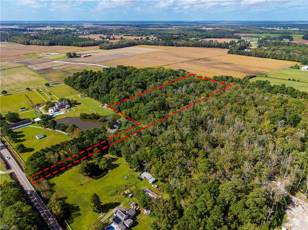 Natural and wild. Rare opportunity to find a completely wooded six acre parcel of land in the heart of Pungo.  Located less than ten minutes from the Pungo light and fifteen minutes from Redmill .  This private and secluded flag lot sits approximately 400' off the hard service road with 20' of road frontage. Ideal situation for the outdoorsman who is looking to enjoy wildlife or create trails to ride ATV's.  This parcel does have the potential for one homesite, barns or outbuildings. Buyer is responsible for own Due Diligence and will have to seek all approvals prior to any construction. The owners do not have any soil work or wetland reports. Property being sold as a wooded parcel that appears to be in a AE flood zone.  Property to convey as-is, where is. Please call City of Va Beach planning for any info concerning building on this chattel.