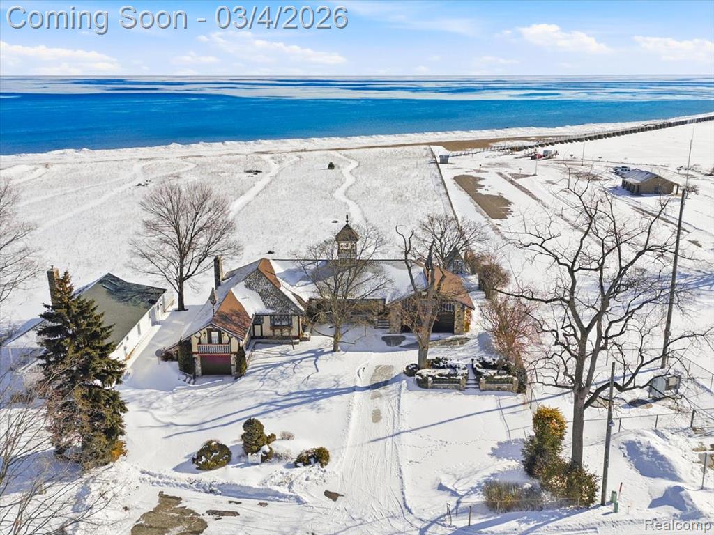 Once-in-a generation harbor-bordering estate offering 191 feet of private, sandy, low bank Lake Huron shoreline on 2.36 acres in sought-after Port Sanilac,  an incredibly rare offering with exceptional frontage and an outstanding beach setting. Positioned directly next to the Port Sanilac Boat Launch, this 2,605 sq ft residence combines expansive living space with what many consider the nicest beach on Lake Huron, a wide, walk-out sandy shoreline ideal for swimming, relaxing, and enjoying the natural beauty of the lake. The gradual entry and soft sand create a true up-north coastal feel that is increasingly difficult to find. Inside, the home has been meticulously maintained over the years and provides generous room sizes, large lake-facing windows, and multiple gathering spaces designed to capture panoramic water views. While the interior reflects its original era, the home offers an outstanding foundation for thoughtful updates, modernization, or a complete custom transformation into a premier waterfront estate. With nearly 200 feet of frontage, the privacy and scale of this property set it apart. Whether envisioned as a legacy family retreat, an executive lakefront residence, or a long-term investment in one of Lake Huron’s most desirable stretches of shoreline, the possibilities are extraordinary. Wake up to stunning sunrises, step directly onto soft sand, and enjoy boating access just steps away. Opportunities of this size and setting seldom come available in Port Sanilac. Listing agent is related to the seller.