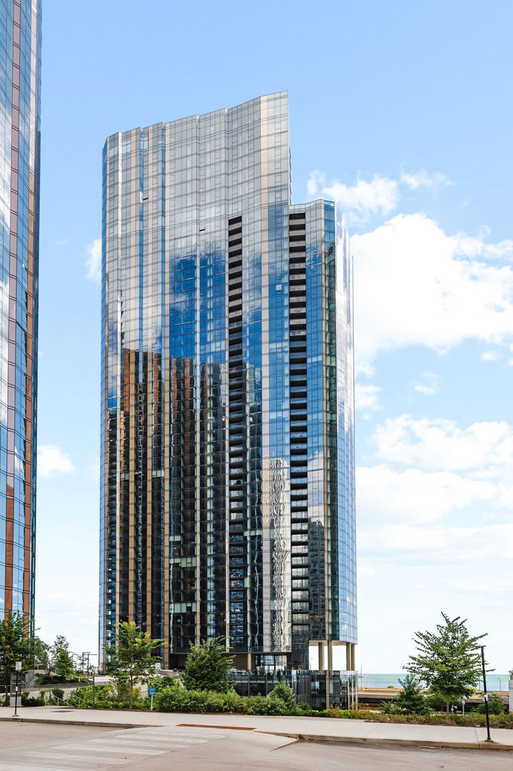 Step into luxury living with this one-of-a-kind penthouse residence, where modern design meets timeless elegance.  Spanning two thoughtfully designed levels, this home offers open, light filled spaces, high-end finishes with stunning unobstructed views of Lake Michigan.  With generous living areas, three ensuite bedrooms, two outdoor spaces, and countless amenities - from the kid's playroom and fitness centers to co-working spaces, in addition to an expansive lounge with a lakefront terrace  - this residence blends modern luxury with the comfort and flexibility for families and professionals alike.  Thoughtfully designed to the highest standards, this home showcases designer selected custom color Italian Snaidero cabinetry, built in espresso machine, Gaggenau appliances, extra wide plank hardwood flooring, and upgraded quartzite in the kitchen, wet bar, and powder room;  The spa inspired primary bath features premium tile and breathtaking lake views, while the primary suite is complete with spacious closets. The Cirrus is nestled within the tranquil yet vibrant Lakeshore East neighborhood and includes more than 48,000 SF or amenities with anything you could want at your fingertips!  Enjoy a state-of-the-art fitness center featuring a strength training area, motion studio for spinning and yoga with complimentary daily fitness classes, steam and massage room, game room area, take a dip in the expansive indoor or outdoor pool, and enjoy the convenience of an all season dog run.  Relax in the private conservatory, movie screening room, enjoy the sports simulator, jam room, maker space, private offices and conference rooms available for your use.  A collection of well-designed amenities that can only be fully appreciated in person.  Relax and unwind or entertain on the 41st floor Sky Lounge - a stunning indoor-outdoor space complete with wine bar, chef's table, catering kitchen, and lakefront terrace featuring fire pits and grilling stations all with panoramic views of Lake Michigan. Live beautifully, live fully - all in a home that truly has it all!