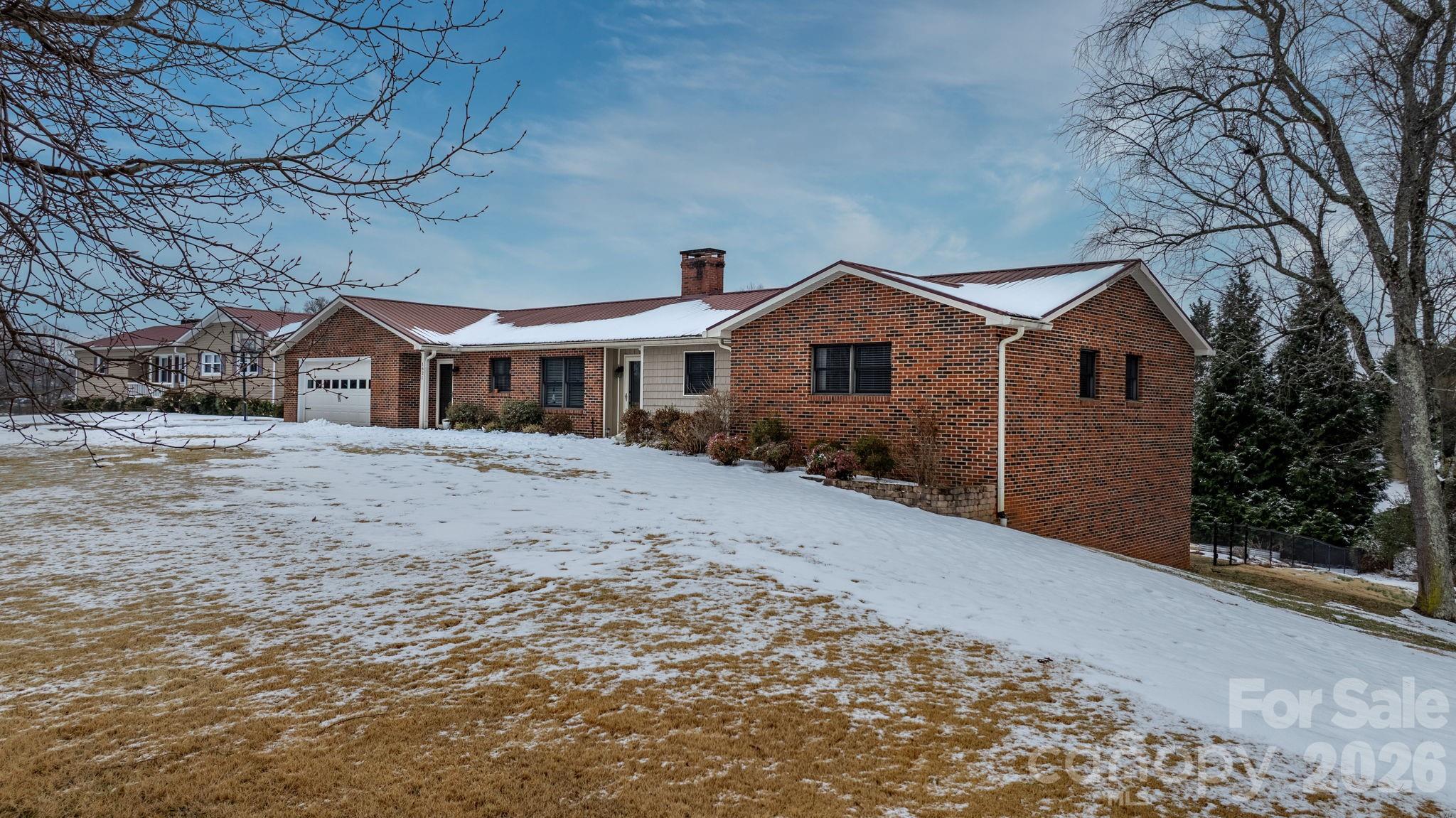 This beautiful 2000 sq ft brick ranch is situated on 1 acre lot in desirable Virginia Acres in Sawmills area. Home features a large primary suite and 2 other bedrooms with another full bathroom, large dining/living room with brick fireplace, gas logs, and upgraded kitchen with breakfast area. Large pantry for all your kitchen storage. Relax in the sunroom or entertain on the attached large screened in porch overlooking the pool with fenced back yard. Other upgrades include new heating/air in 2020, hardwood floors, granite countertops and tile backsplash in kitchen. Unfinished basement great for storage. Large one level living with 2 car garage and a 2nd entrance through laundry/mudroom.