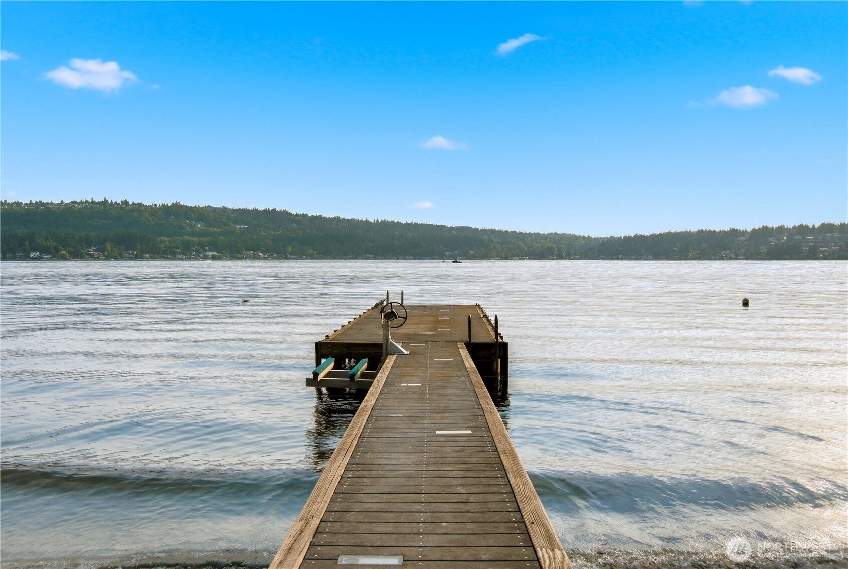 Private waterfront dock on Lake Sammamish offering boating, paddleboarding, swimming and spectacular sunsets.