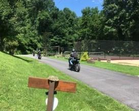 This pristine 24-acre natural oasis offers extraordinary possibilities. Unrestricted with room to customize and grow, the property has operated successfully as a retreat center for nearly two decades. Its existing infrastructure is extensive, featuring two charming 2 bed/2 bath log cabins with wood burning fireplaces, an official-size gymnasium with 2 separate shower/restrooms, a fully equipped commercial kitchen with caf/restaurant space with half bath, a tennis court, and a campground that includes three yurts, tent sites, a tiny house, and a picnic area with grills and a composting toilet. An additional office building features a bunkroom, restrooms, garage and studio space currently used as a spa room. Paved roads and parking throughout the property.  A commercial well and septic systems serve the main buildings, with additional utilities already in place for the residential structures.  Surrounded by U.S. Forest Service land, the property enjoys exceptional privacy and mountain views—perfect for taking in breathtaking sunrises. The land itself is a treasure, home to rare wildflowers and abundant stands of poplar, oak, and beech.  Outdoor recreation is all around you. Explore world-class hiking in the Great Smoky Mountains National Park, the Appalachian Trail, or the ancient forests of the Joyce Kilmer/Slickrock Wilderness. Experience whitewater rafting and kayaking on the Cheoah River, or enjoy boating, paddleboarding, and fishing on several nearby lakes, including Lake Santeetlah—often named one of the most beautiful lakes in the country—as well as Cheoah and Fontana Lakes. For motor enthusiasts, the legendary Tail of the Dragon is less than 15 minutes away, offering a unique opportunity for riding or marketing to its devoted following.  A rare combination of natural beauty, existing amenities, and limitless potential, this property is ideal for a private estate, retreat center, or visionary development. Appointment required. No drive-bys, please.