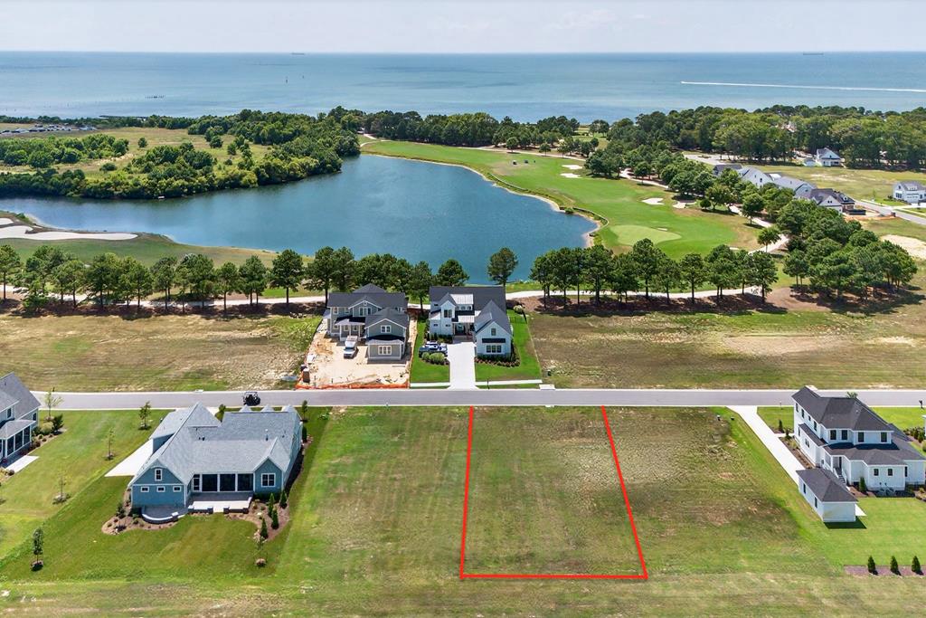 Muirfield Lot 95 in Bay Creek, a premier coastal golf community. This spacious homesite offers stunning western views and is just steps from the Life Center, private beach access, and other resort-style amenities. Seller is offering a $25,000 credit toward the Club Membership Joining Fee at closing. No required timeline to build! Builders Guild and Architectural Guidelines make the process seamless. Enjoy 27 holes of golf, 2 miles of private beaches, tennis, pickleball, scenic trails, and a golf cart-friendly lifestyle. Just minutes from Historic Cape Charles. Contact the listing agent today to learn more!