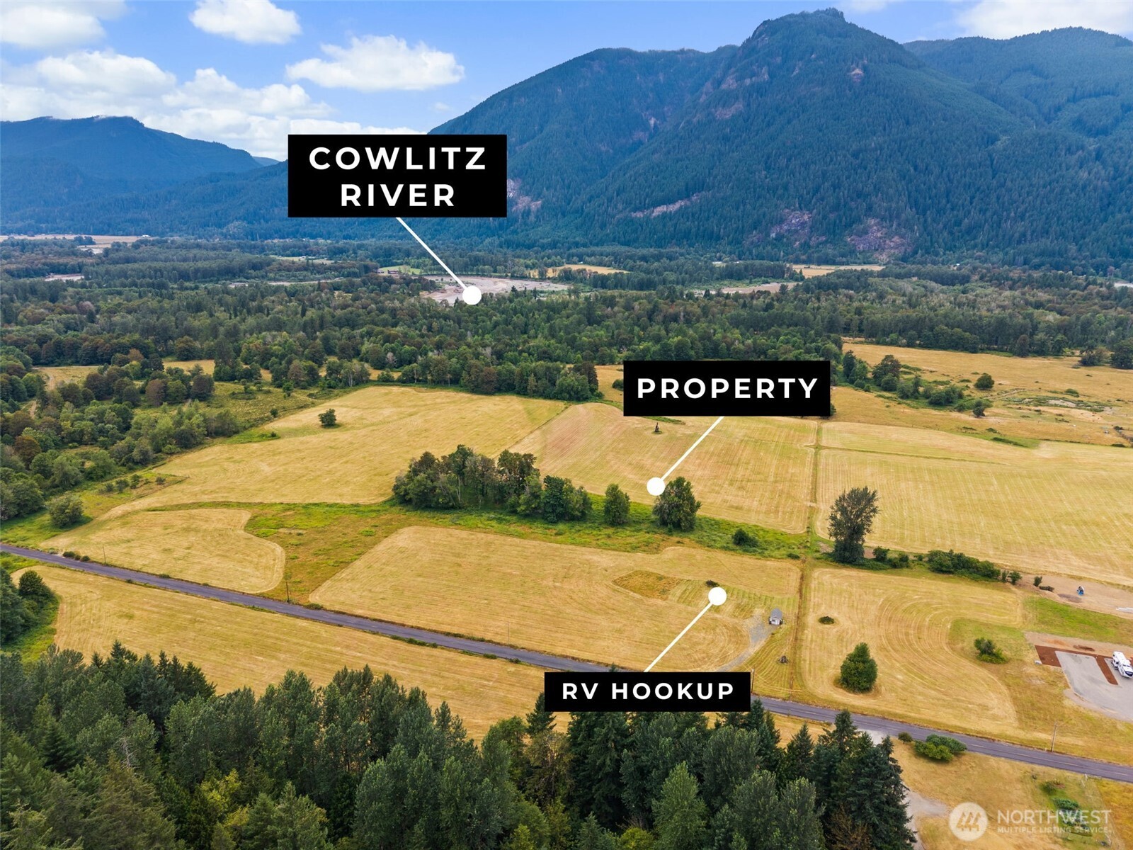 Discover an exceptional opportunity to own over 20 acres of highly sought-after Cline Road "elk viewing" property in beautiful Packwood/Randle area. This picturesque retreat offers the perfect blend of privacy, recreation, and future potential. The property is already well-equipped with five full hookup RV sites, each featuring water, power, and septic, making it ideal for hosting friends or creating an income-producing getaway. A wash shed with a full bathroom and loft is ready for your finishing touches, offering endless possibilities. With an existing well, septic system, and power already in place, much of the groundwork has been completed for your dream home or mountain retreat. Renowned for its abundant wildlife, the area is a favorite destination for outdoor enthusiasts, with frequent elk sightings right from the property and convenient access to nearby public lands offering exceptional hunting opportunities. Whether you're scouting for the season, pursuing elk and deer in the surrounding forests, or simply enjoying the incredible wildlife that calls this area home, this property is an ideal basecamp for every adventure. Located near the Cowlitz River and surrounded by breathtaking territorial views, you'll enjoy the best of the Pacific Northwest with fishing, hiking, hunting, skiing, and year-round recreation just minutes away. This is a rare opportunity to own a truly special piece of Packwood's outdoor paradise.