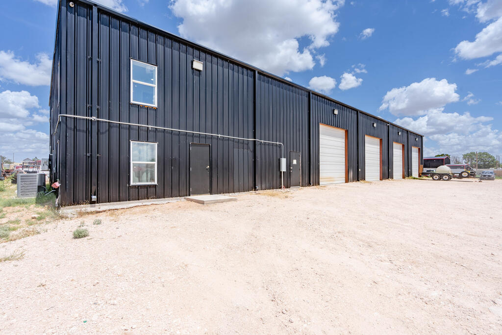 Great commercial property on almost 4 acres. Huge shop with 4 bay doors. The office building has 5 office spaces, 4 restrooms and a meeting room plus reception area. Come take a look at this property today!