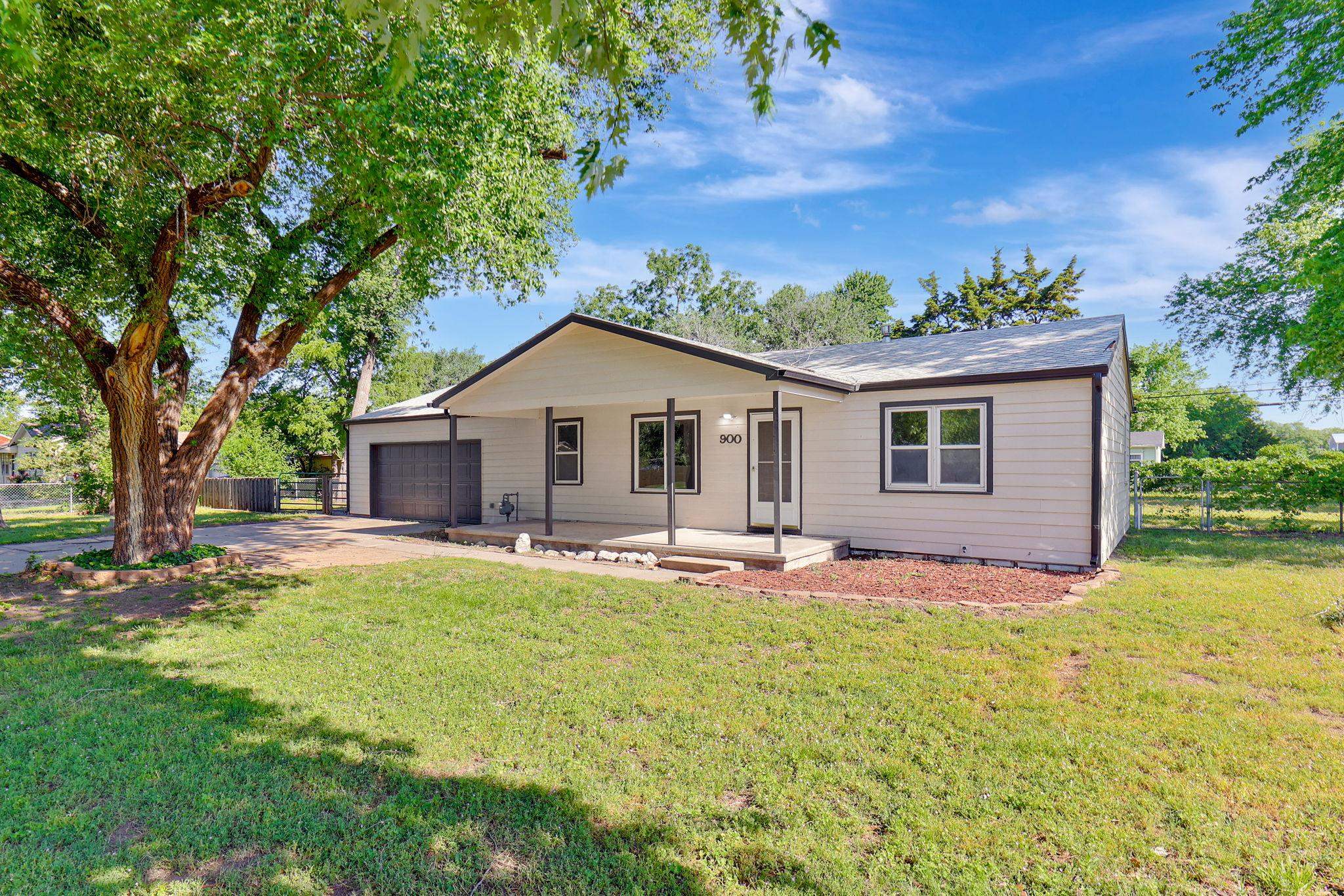 Welcome to 900 W 51st St S, a delightful 3-bedroom, 1-bathroom home nestled on a generous 0.36-acre lot in the tranquil Seneca Gardens neighborhood of southwest Wichita. This 1,140 sq ft residence offers a perfect blend of comfort, style, and functionality.  Many updates have already been made.  Newer roof and windows, all new flooring and lighting, fresh interior and exterior paint.   The large kitchen has been updated and has brand new appliances.  This home also has a large, attached garage perfect for storage.  Step out back to the large, fenced yard and the opportunities are endless as to what you can do.  Build that shop or plant your garden.  This home is truly move in ready.  Hurry it won't last!!!