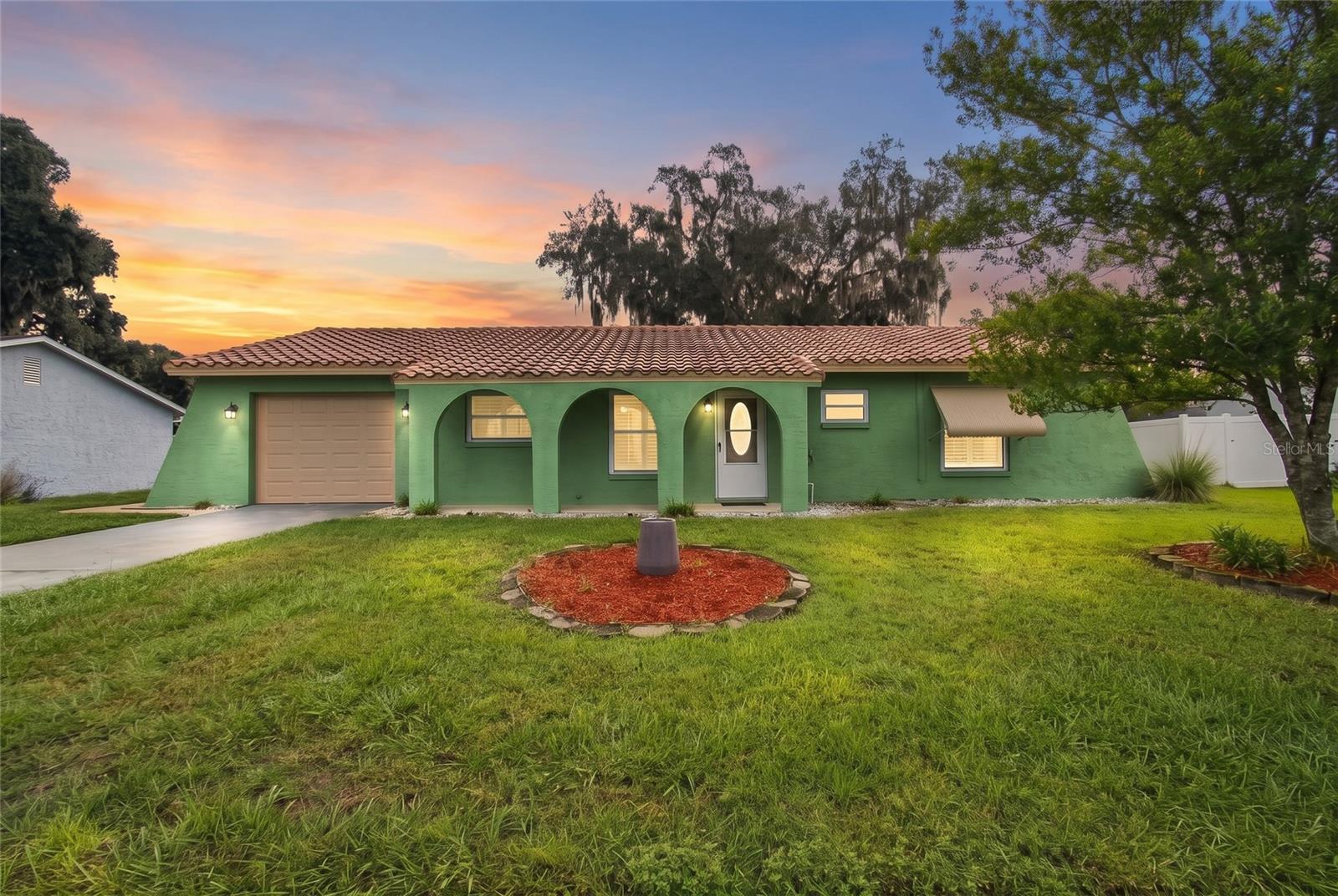 ***ELIGIBLE FOR 100% USDA FINANCING***  WELCOME HOME to this beautifully maintained, turn-key residence in the quaint and peaceful Lake Dorothea neighborhood of North Zephyrhills! This charming home is cute, comfortable, and loaded with big-ticket updates and upgrades that provide tremendous bang for your buck! Step inside to a light and airy living space featuring NEW INTERIOR PAINT (2025) and sleek, stylish PLANTATION SHUTTERS that create a warm and contemporary feel. You’ll be pleasantly surprised by the modern finishes and quality craftsmanship throughout, including SOLID WOOD CABINETRY with soft-close drawers in the completely UPDATED KITCHEN and BATHROOMS. Cooking is a true delight with spacious GRANITE COUNTERTOPS, a deep double-basin undermount sink, and a WHIRLPOOL APPLIANCE SUITE including a NEW RANGE (2026), refrigerator (2025), and dishwasher (2024)! This home also boasts some incredible structural and ENERGY-EFFICIENT UPDATES that provide peace of mind for years to come, including a NEW HVAC UNIT (2024), durable TILE ROOF (2017), and DOUBLE-HUNG WINDOWS (2013) that help keep utility costs low. Florida living unfolds seamlessly from the spacious FLORIDA ROOM (10x18), enclosed with REAL GLASS WINDOWS and offering a peaceful place to unwind, to the expanded COVERED REAR PATIO (10x17), perfect for grilling and dining al fresco. The DETACHED SHED and oversized SINGLE-CAR GARAGE (14x28) offer plenty of storage and space to tinker, too! Even Goldilocks would say this .25-ACRE LOT is just right! It’s not too much to maintain, yet offers plenty of room for gardening, pets, adding a pool, or parking your RV or boat! LAKE DOROTHEA is a traditional, peaceful, and relaxed neighborhood where you can enjoy sidewalks and street lighting while still having the freedom to curate the lifestyle you desire. The LOW-COST HOA of just $300 ANNUALLY covers maintenance of the common areas, including a tranquil nature park with seating for bird watching. If you’re ready to start living your best Florida life, this one is ready to welcome you home! Call today to schedule your private tour!