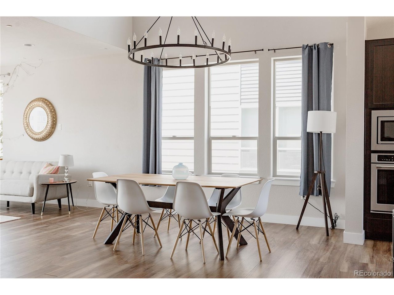 Stunning end-unit townhome in the heart of Central Park, built in 2017 with 1,863 sq ft of bright, light-filled, modern living. The open main level boasts soaring ceilings, a stylish kitchen, and a relaxing balcony. Two bedrooms plus a dedicated office and three baths offer flexible space. The serene primary suite features a spa-inspired bath with oversized walk-in shower, dual-sink vanity, and walk-in closet. An expansive rooftop deck delivers gorgeous mountain views. The spacious three-car garage includes a flexible third bay-ideal for a home gym, extra storage, or a third vehicle. Steps from Central Park's parks, pools, and trails with easy access to dining and the A-Line train. Enjoy low-maintenance, lock-and-leave living with modern updates and quality finishes at an exceptional value.