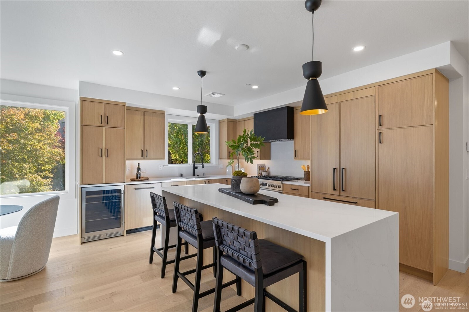 Welcome to this bright and modern downtown Kirkland condo in a prime location. This 2025 fully remodeled unit boasts stunning modern upgrades, open layout, and urban convenience. Just steps to the waterfront, Kirkland Urban, PCC, parks, shops, restaurants, and transit, this home offers the best of city living with a relaxed neighborhood feel. Featuring 3 spacious beds and 3 beautifully updated baths, this home is designed for comfort, functionality, and style. The contemporary chef’s kitchen shines with high-end appliances, granite countertops, a custom tile backsplash, and an oversized island perfect for entertaining or casual dining.  2 secured parking spots. Rare opportunity to live in the heart of Kirkland with no compromise on luxury.