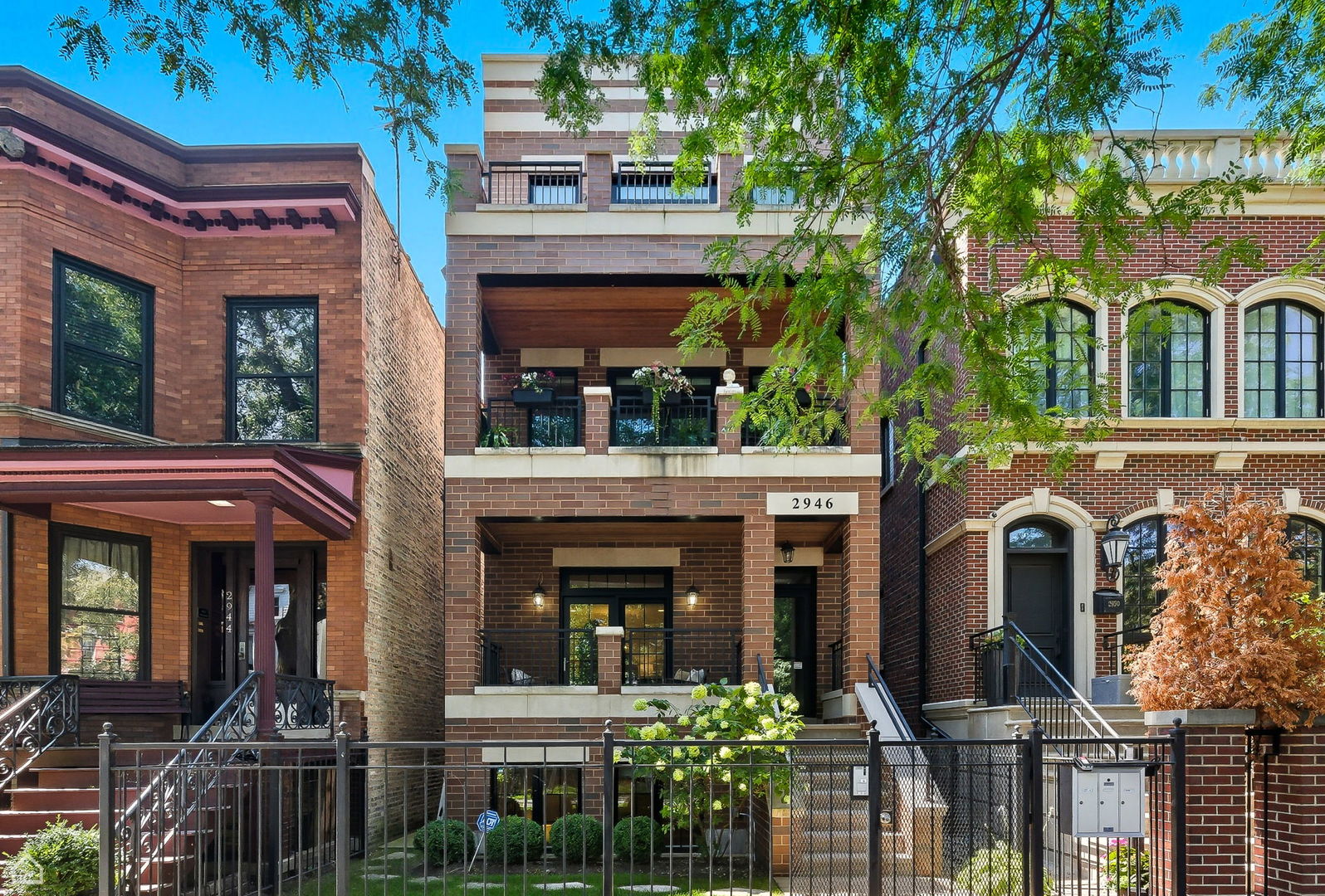 Like-New 4 Bedroom Duplex Down in Prime Lakeview Location. Built in 2016, this 4 bedroom 2.1 bathroom ALL BRICK home boasts approximately 2,500 square feet and lives like a single-family home with rare extra-wide garage parking in an all-brick, two-unit building. Thoughtfully upgraded throughout, this home offers exceptional space for entertaining, everyday living, and working from home.    The sun-filled main level showcases high ceilings with elegant crown molding, a front balcony with transom window, and an inviting living/dining area centered around a floor-to-ceiling stone fireplace flanked by custom built-ins. A covered balcony with Trex decking and gas line extends your living space outdoors.    The chef's kitchen features Sub-Zero, Wolf, and Bosch appliances, quartz countertops, subway tile backsplash, farm sink, oversized island with eat-in seating, plus pantry and wet bar with beverage fridge. The kitchen opens seamlessly to a generous family room-perfect for gathering.    Thew lower level, which is only 4 feet below grade, features radiant heated floors run throughout all four bedrooms. The luxurious primary suite includes a walk-in closet with custom dual armoires and a spa-like marble bath with double vanity, air-jet soaking tub, and steam shower with rain head and body sprays. Three additional bedrooms with built-out closets share a full hall bath. Side-by-side laundry with countertop and storage, plus two additional closets (one with utility sink), complete the level.    You will love the fully outfitted private garage roof deck complete with: watering system, shades, overhead radiant heat lamps, lighting, sound, pergola and composite decking.   Additional highlights include: surround sound inside and out, wider plank oak hardwood flooring, security system, and abundant storage.   This intimate, set-back building is exceptionally quiet with only one neighbor. The garage features only two cars, providing extra-wide parking and a private storage closet for this unit.    All within walking distance to restaurants, the Wellington (Brown/Purple) and Belmont (Red) El stops, Tubman Elementary previously KA -Agassiz Elementary, Target, Whole Foods, Trader Joe's, parks, and more.