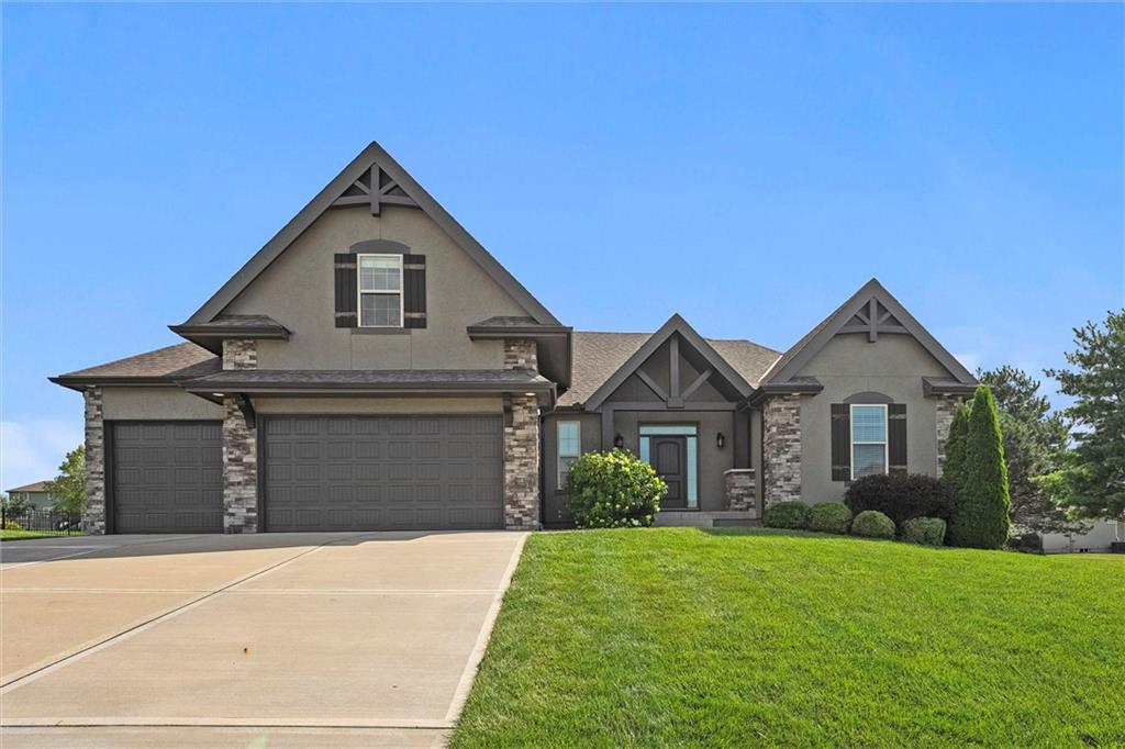 WELCOME HOME! Where Luxury Meets Lifestyle!

Step into this stunning home featuring an open floor plan with soaring ceilings and upgrades galore! Gorgeous engineered hardwood flooring flows throughout the main level, offering warmth and sophistication from the moment you enter.

The spacious Great Room is anchored by a striking see-through fireplace—perfectly positioned to be enjoyed both indoors and from the covered patio outdoors, making entertaining seamless in any season.

The gourmet kitchen is a chef’s dream with granite countertops, a large center split island, stainless steel appliances, a walk-in pantry, and custom cabinetry. Adjacent dining and living spaces make hosting family and friends effortless.

Retreat to the expansive main-level master suite complete with a luxurious ensuite bath featuring dual vanities, a walk-in shower, soaking tub, and a massive walk-in closet.

Upstairs, you'll find three spacious bedrooms—including one with stunning built-ins, a walk-in closet, and a private ensuite bath. The other two bedrooms each feature walk-in closets and share a convenient Jack-and-Jill bathroom. A bonus office niche completes the upper level, perfect for working or studying from home.

The exterior boasts curb appeal with a manicured lawn and in-ground sprinkler system. Community perks include access to a lakeside pool, clubhouse, marina, playground, and scenic walking trails.

Don’t miss your chance to live in this beautifully designed home in a highly sought-after lake community!