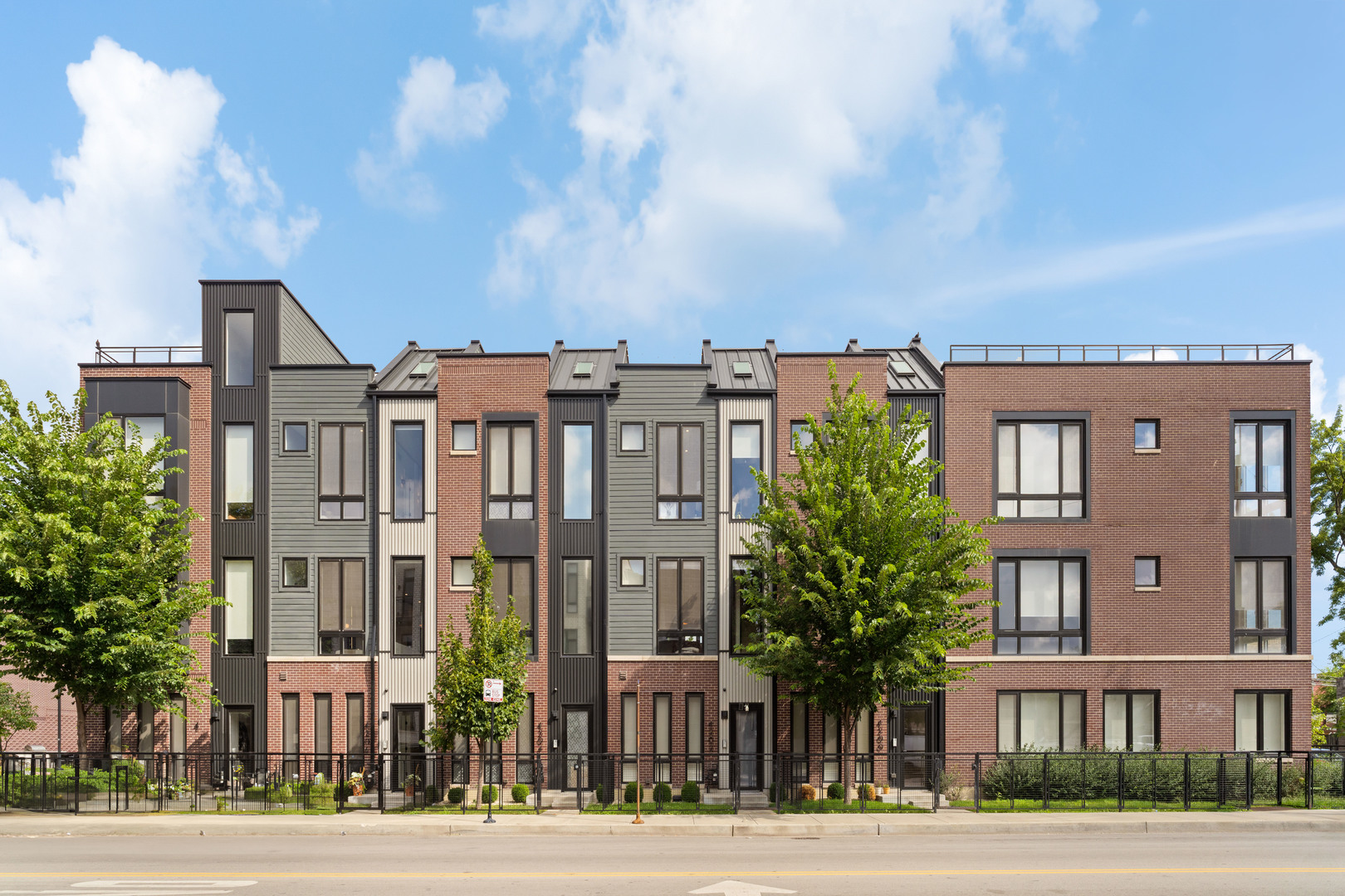 Introducing Avondale Reserve Townhomes, a new age development within one of Chicago's most historic and vibrant neighborhoods.  Developed by award-winning Noah Properties and designed by Lisek Interiors, this private, gated community features 52 upscale townhomes ranging from 1,950 to 4,250 square feet, thoughtfully designed for today's modern lifestyle. Each residence offers the space, privacy, and security of single-family living, complete with a private gated front yard, attached two car garage, and secure entry.  Located in the quiet courtyard, set back off of Belmont, this 3-bedroom, 3.1-bathroom sun drenched home features custom European cabinetry, chef-style kitchen with oversized island and stainless-steel appliances, custom build-outs, fireplace, spa-like baths, private rooftop deck and attached 2-car garage.  Just steps from your front door, homeowners can also enjoy amenities such as grilling stations and outdoor dining area, fenced in dog run, pet grooming shower, and an indoor fitness center outfitted with multiple 60" TVs, private changing rooms, weight & cardio equipment and more.  Move-In Ready. Photos are of the furnished model.