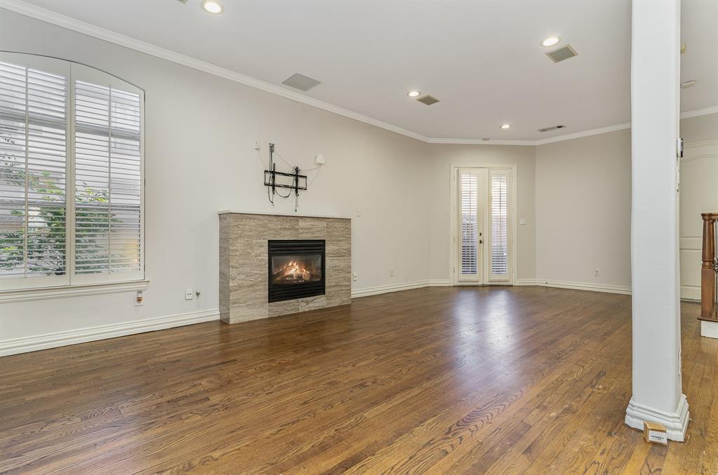 Welcome home! Located in the highly desirable Portobello by the Creek community in Uptown Dallas, this beautifully maintained corner-lot townhome offers an exceptional combination of style, comfort, and low-maintenance living. Featuring 2 bedrooms, 3 full bathrooms, and a versatile third-floor bonus room with its own private full bath, this flexible floor plan can easily serve as a third bedroom, guest suite, home office, or media room.The open-concept main level is designed for both everyday living and entertaining, showcasing rich hardwood floors, abundant natural light, a cozy fireplace, and a stunning chef's kitchen complete with an oversized island, granite countertops, custom cabinetry, and Viking gas range, Built in Refrigerator.  The spacious primary suite features a luxurious ensuite bathroom, while the secondary bedroom enjoys private balcony access, creating the perfect retreat for morning coffee or evening relaxation.This home also offers modern conveniences with smart home features and EV charging capability, providing efficiency and future-ready living.Step outside to a beautiful private backyard patio with plenty of space for outdoor dining, entertaining, or simply enjoying peaceful mornings and evenings. As a corner-unit residence, the home benefits from added privacy and natural light throughout. The front yard has full turf! Residents of Portobello by the Creek enjoy access to a resort-style community pool, while the HOA provides front lawn maintenance for a true lock-and-leave lifestyle. Ideally located just minutes from the Katy Trail, premier shopping, dining, and entertainment throughout Uptown and Knox-Henderson, this home offers the best of Dallas living in one of the area's most sought-after communities.