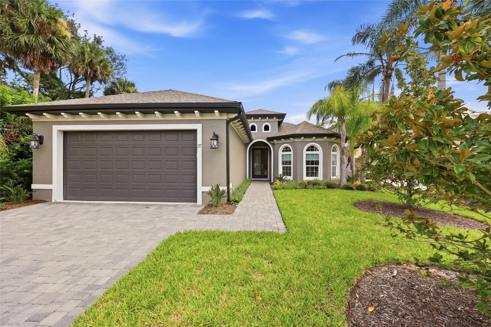 Be prepared to check off everything on your wish list with this pristine home by one of Palm Coast Florida's premier builders. GATED COMMUNITY, INTRACOASTAL LOCATION, DOCK WITH 10000 LB LIFT, POOL WITH BAJA SHELF, OUTDOOR KITCHEN, ONE LEVEL LIVING, 10 FOOT CEILINGS THROUGHOUT, CUSTOM ARCHITECTURAL ACCENTS, QUARTZITE COUNTERTOPS, 2 ENSUITE BEDROOMS, FLEX ROOM COULD BE AN OFFICE, MEDIA, EXERCISE OR 4TH BEDROOM, TILED SHOWERS, HURRICANE SHUTTERS, FENCE FOR THE FUR BABIES, WINDOW SHADES ARE JUST SOME OF THE FEATURES.  This home is like new as owner had a change of plans shortly after purchasing, his loss is your gain.  The home lives much larger than the square footage indicates. With 3 large bedrooms and a flex room, large entry foyer, and ample dining room to entertain family and friends.   Quality finishes like custom cabinetry, high coffered ceilings, many windows create a light and bright home and oversized windows to capture your views of the Intracoastal and pool, abundance of landscaping, oversized laundry room, paver driveway, Move in ready and you can start to enjoy immediately.  Palm Coast Plantation is one of our most desirable areas with amenities that will appeal to everyone.  Olympic size community pool on the lake, fitness center, tennis courts and public docks are just some of the things to enjoy. Need extra storage for your RV or boat check out the convenient storage available to residents. Every convenience is just around the corner, beautiful Flagler Beach is minutes away, grocery, restaurants, drug stores, banking are all a short distance.   Palm Coast is the best kept secret in Florida. Miles of beautiful beaches, over 125 miles of bike paths, beautiful parks along Intracoastal Waterway, a thriving art & theater community, home of famous artists, golf courses for every day, fishing, boating, wind sailing, surfing, canoeing are just a few of the things to do. Orlando and Disney World are close for a day outing and Jacksonville with all the shopping one could desire & the famous Mayo Clinic is one hour. NASCAR & ST. Augustine are within a thirty-minute drive.