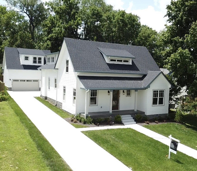 Gorgeous new build in the heart of East Nashvilles, Eastwood Neighbors. Fully equipped with a Detached guest house above a 2 car garage, this stunning home was built to the nines with designer finishes by locally renowned design firm, Quinn and Co. From the formal dining room with coffered ceilings to the state of the art Kitchen, huge pantry, wine Bar, 1st floor primary suite, huge upstairs bonus room, designer lighting, gorgeous millwork and much more, all while being steps away from dozens of East Nashvilles best restaurants including Noko, Cafe Roze, Yellow Table, Two Ten Jack and many more. Don't miss this amazing home in one of the most charming pockets in East Nashville. Ask about the Builders 2% interest buy down credit!!!