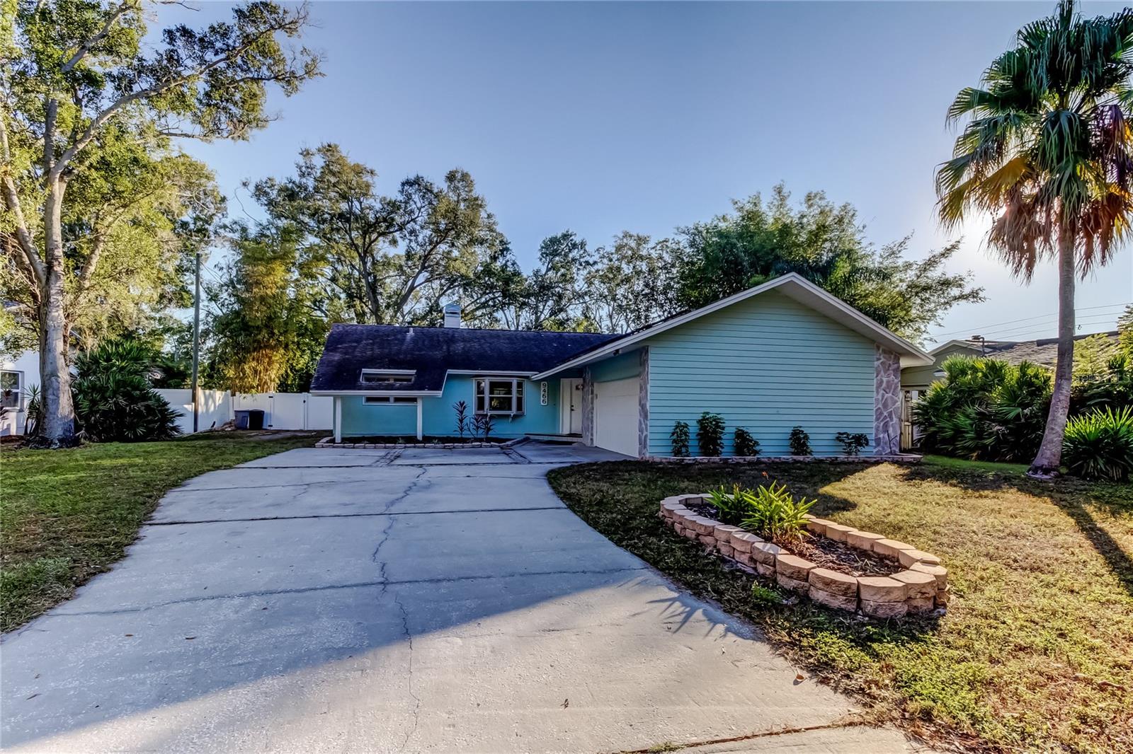 Welcome to a home that feels especially right this time of year. This beautifully updated 3 bedroom, 2 bathroom residence offers 1,850 square feet of thoughtfully designed living space on over a quarter acre, tucked into a quiet neighborhood yet close to everything Largo has to offer. The kind of place where holidays are hosted, traditions are made, and guests never want to leave.Step inside to a bright, open interior with rich hickory hardwood floors and a layout that was made for gathering. The kitchen truly steals the show and during the holidays, it becomes the heart of it all. This is a big, open space with abundant cabinetry, generous storage, and room for everyone to linger. Quartz countertops, a premium Thermador gas range, a sleek wine bar, and an oversized granite island with seating for six make it perfect for Christmas morning brunch, cookie baking marathons, and hosting a festive holiday party without feeling crowded.The open flow continues into the living area and the enclosed Florida room, offering plenty of space for entertaining, relaxing, or setting up a cozy spot to unwind after the celebrations. Out back, the private yard feels like a year-round retreat with a jacuzzi, low maintenance synthetic turf, and tropical landscaping. Holiday lights optional, good vibes guaranteed.The primary suite features a custom California Closet system so everything has a place. One secondary bedroom includes a Murphy bed, ideal for hosting overnight guests, while the other offers a desk and Murphy bed combo for maximum flexibility. Home office by day, guest room by night.Some big updates are already done. The AC was replaced in 2025, the water heater in 2024, and fully paid off solar panels help keep energy bills in check, even with the holiday lights on. A 100 gallon propane tank powers the gas range and dryer for added efficiency. No HOA. No CDD. A long driveway provides plenty of parking for friends and family stopping by.Whether you’re hosting Christmas dinner, ringing in the New Year, or simply enjoying a quiet holiday at home, this is a place that makes every season feel special. Come see it today and picture your holidays here!