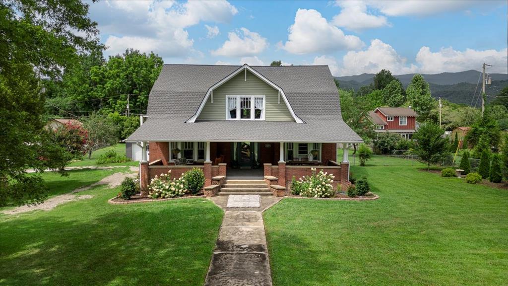 Step back in time and fall in love with this timelessly beautiful home, built in 1923 and lovingly maintained and updated to preserve its classic charm. Nestled within the city limits of Andrews, this inviting residence offers the perfect blend of character, space, and convenience.  From the moment you arrive, you'll appreciate the welcoming front porch, ideal for relaxing with a morning coffee or evening breeze. Inside, you'll find a warm and inviting interior with original details, abundant natural light, and plenty of room to spread out.  The home boasts generous living spaces, perfect for both everyday living and entertaining. Several updates include: Roof replacement in 2024, New siding in 2025- enhancing both curb appeal and insulation, Nine ductless split units were installed throughout the home in 2023, From 2023-2024- the following appliances were added: refrigerator, oven, dishwasher, water heater, freestanding gas stove, and the washer/ dryer. Outside, a large, level yard offers endless possibilities—whether you envision a garden, outdoor gatherings, or simply a peaceful retreat.  A detached two-car garage provides ample storage and parking, and the prime location means you're just minutes from downtown shopping, dining, and schools. For outdoor lovers, hiking, rafting, and countless other adventures await nearby in the surrounding mountains and rivers.  Don't miss the opportunity to own a piece of history with all the modern-day comforts. This home is truly a rare gem in beautiful Andrews!