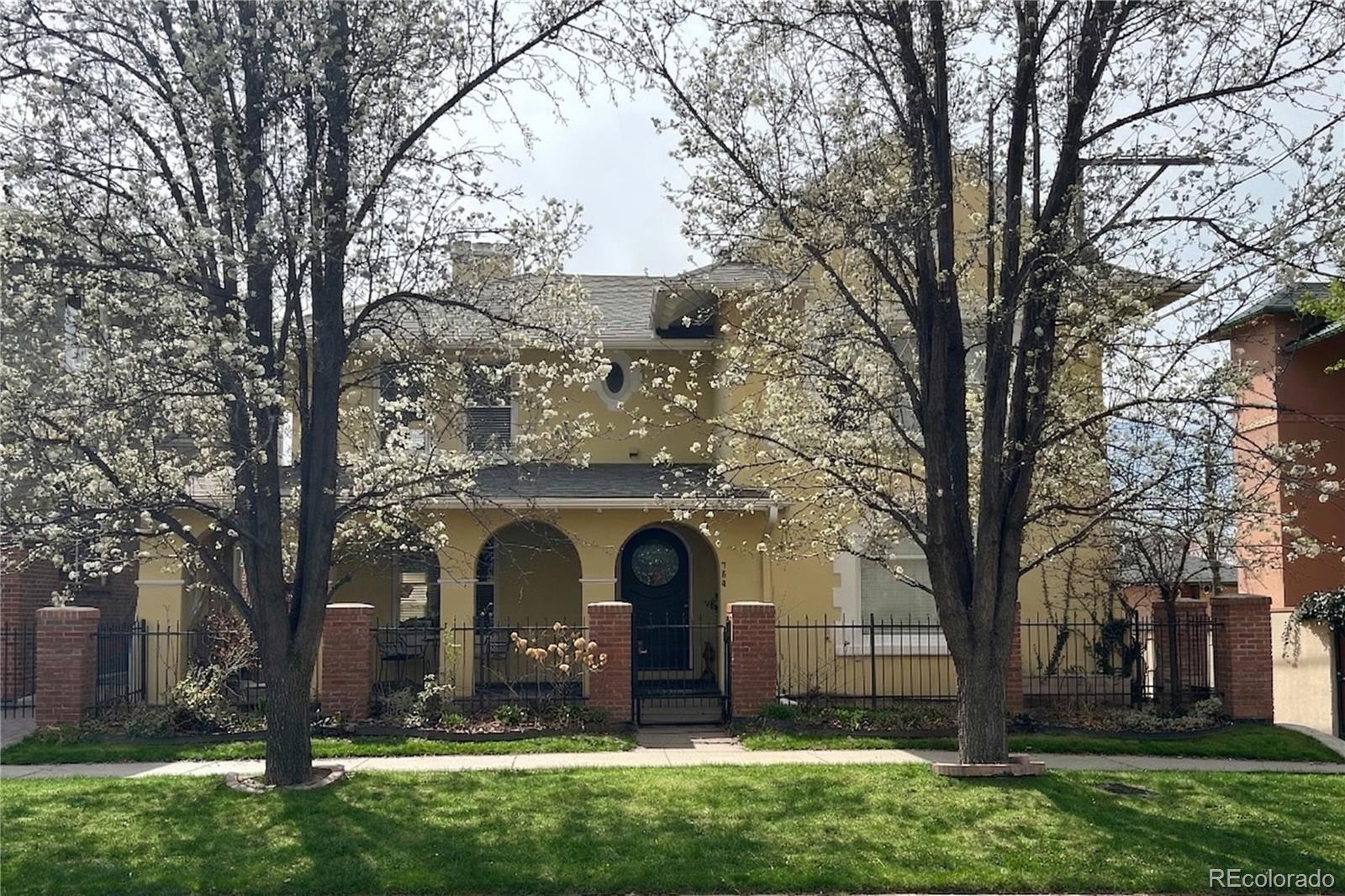Nestled in one of Denver’s most sought-after historic districts, this beautiful home is full of charm, comfort, and timeless character. From the moment you arrive, the inviting front porch welcomes you in — the perfect place for morning coffee, evening conversations, and quiet moments at the end of the day. Inside, rich hardwood floors, generous living spaces, and a large kitchen with granite countertops create a home that feels both elegant and effortless.Upstairs, the spacious primary suite offers a peaceful retreat, complete with its own private balcony — an ideal spot to unwind and take in the neighborhood’s beauty. A second balcony on the main floor adds even more space to relax or entertain. The finished basement expands the home’s warmth and versatility with an additional living room and a wine cellar, creating the perfect setting for quiet movie nights in or hosting family and friends. An attached 2-car garage and heated driveway bring added convenience year-round. Just steps from local restaurants, charming shops, Cheesman Park, and the Denver Botanic Gardens, this home offers not only an exceptional place to live, but a lifestyle to truly love.