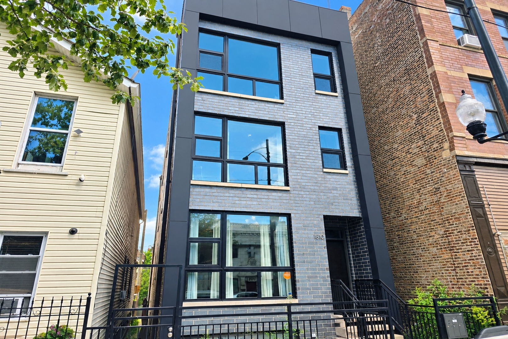 PILSEN PERFECTION! SPACE, STYLE & LOCATION ALL IN ONE!    Get ready to fall in love with this sprawling, 2019-built 4-bedroom, 3-bathroom duplex-down in the heart of Pilsen! With gorgeous finishes, a smart open-concept layout, and room for everyone to spread out, this home delivers the kind of space and style that's hard to find.    The east-facing living room makes a fabulous first impression, with floor-to-ceiling windows flooding the space with natural light. There's plenty of room to entertain, a dedicated spot for your dining table, and a stunning kitchen that steals the show! Think Bosch slate black stainless-steel appliances, sleek quartz countertops, a gorgeous backsplash, and an oversized breakfast bar that's perfect for morning coffee, casual meals, or gathering with friends.    The main level continues to impress with a spacious second bedroom and a showstopping primary suite featuring beautiful woodwork and statement wainscoting behind the bed. The spa-inspired primary bath feels like your own private retreat, complete with chevron tile flooring, a generous walk-in shower, a picturesque soaking tub, and a double-sink quartz vanity. A second full bathroom with a tub/shower combination and double-sink quartz vanity adds even more convenience. Step outside to your covered rear deck and enjoy a little fresh air without leaving home.    Head downstairs and discover even more room to live, work, relax, and entertain! The generous family room is made for movie nights, game days, and cozy evenings in. Two additional well-sized bedrooms, a third full bathroom with a walk-in shower and double-sink quartz vanity, and a dedicated laundry room with utility sink make this lower level as functional as it is inviting.    And the extras? They're just as impressive! An additional exterior storage unit and garage parking are included - two valuable perks that make city living that much easier.    Then there's the location! You're minutes from Pilsen favorites including Thalia Hall, Pilsen Yards, La Vaca, Senorita's Cantina, HaiSous Vietnamese Kitchen, Tonk BBQ, La Luna, and countless other restaurants, bars, and neighborhood gems. With easy access to major expressways, the Halsted Street Metra station, and the 18th Street Pink Line, getting around Chicago is a breeze.    Four bedrooms. Three full baths. Two levels of incredible living space. One fantastic Pilsen location. This is the kind of home that checks all the boxes - and then some!