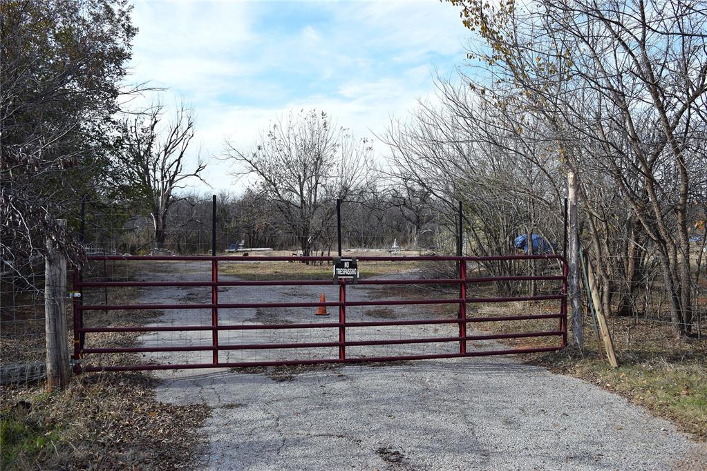 This wooded acreage backs up to a larger pond and is just a few minutes from Edmond.